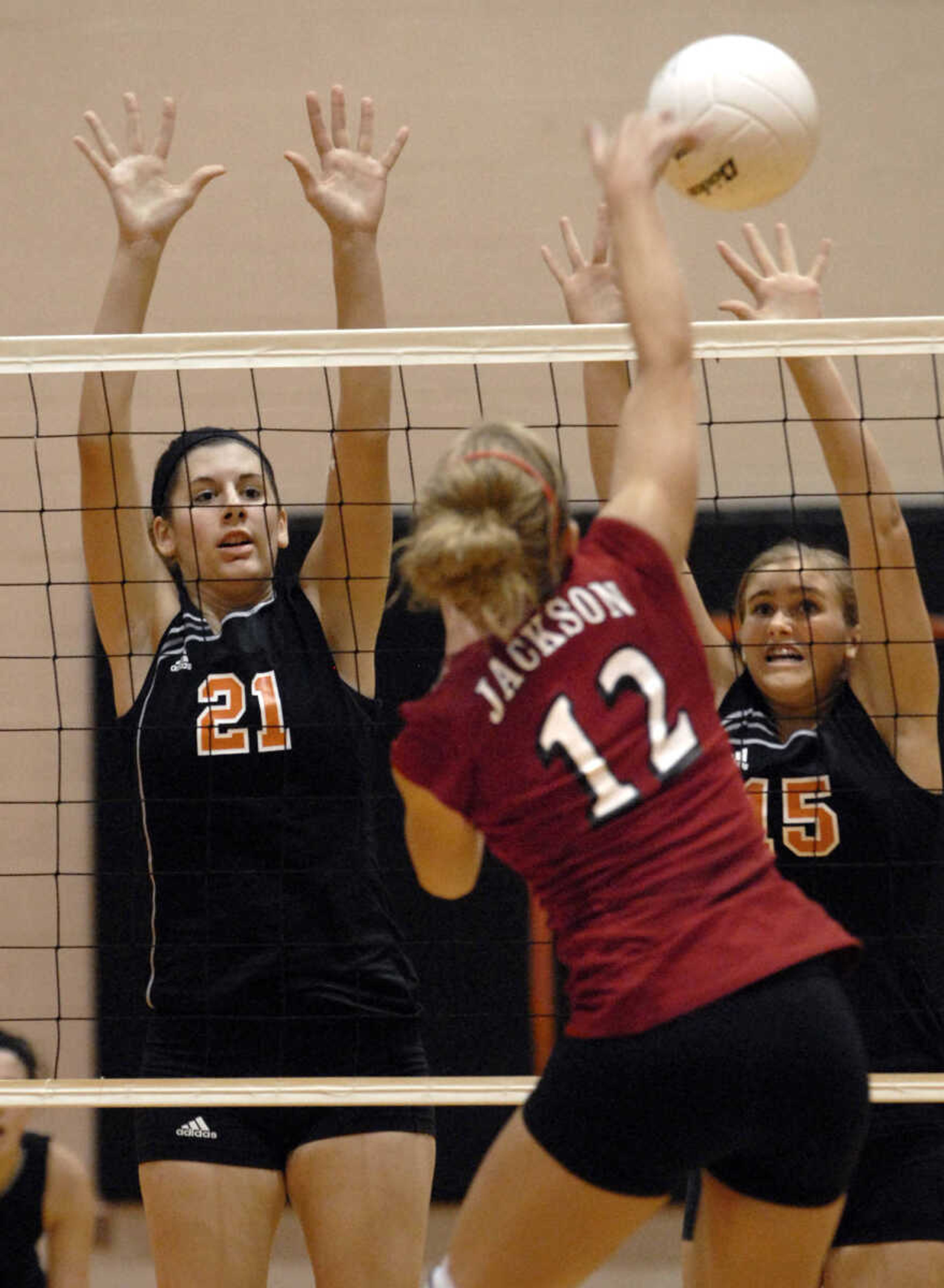 FRED LYNCH ~ flynch@semissourian.com
Central's Chelsea Pannier, left, and Tori Scheller try to block a shot by Jackson's Taylor Glueck in the first game Wednesday at Central.