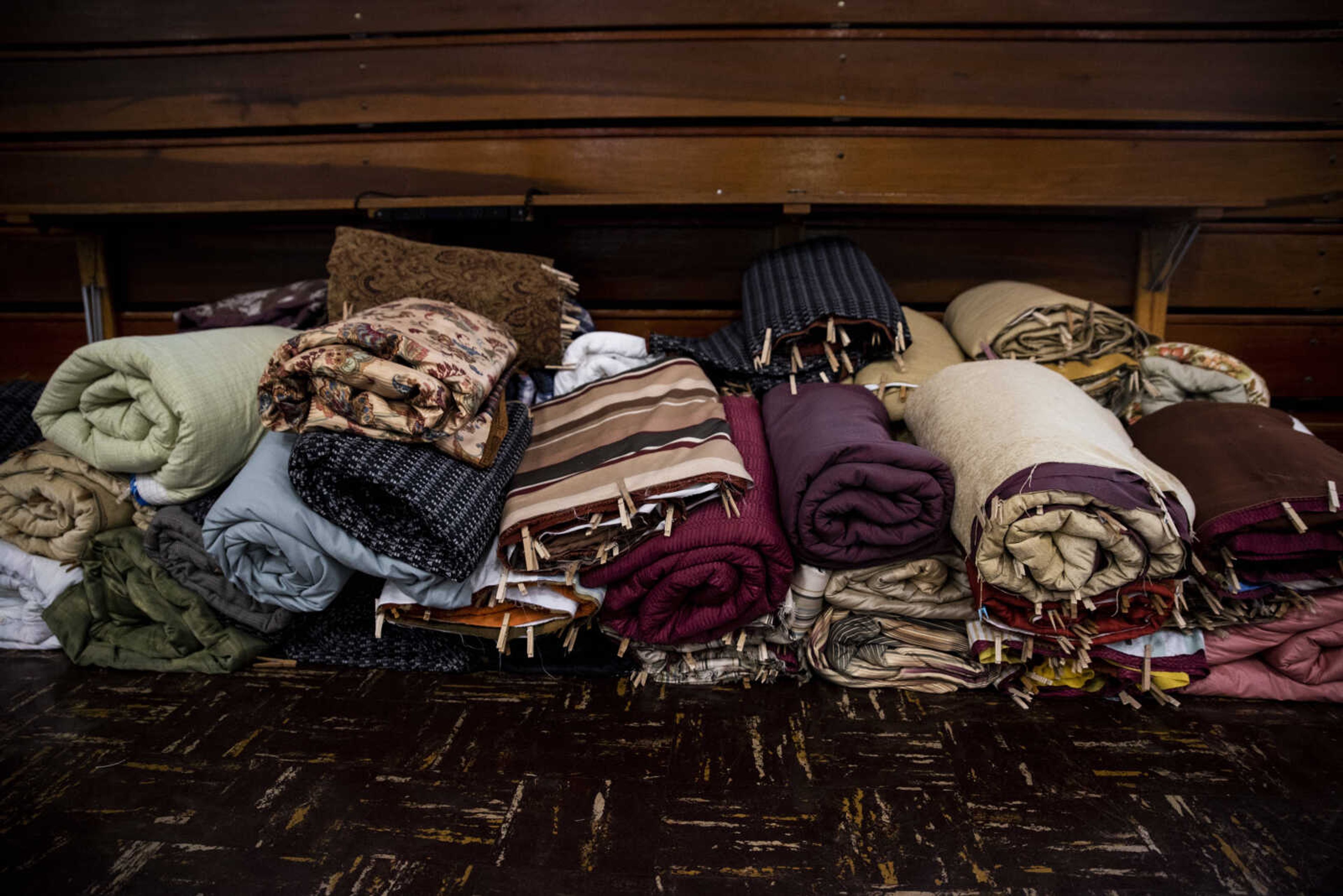 In-process bed rolls sit in a pile awaiting their turn to be tacked together during the Ugly Quilt Weekend at St. Vincent de Paul Parish Sunday, Oct. 28, 2018, in Cape Girardeau.