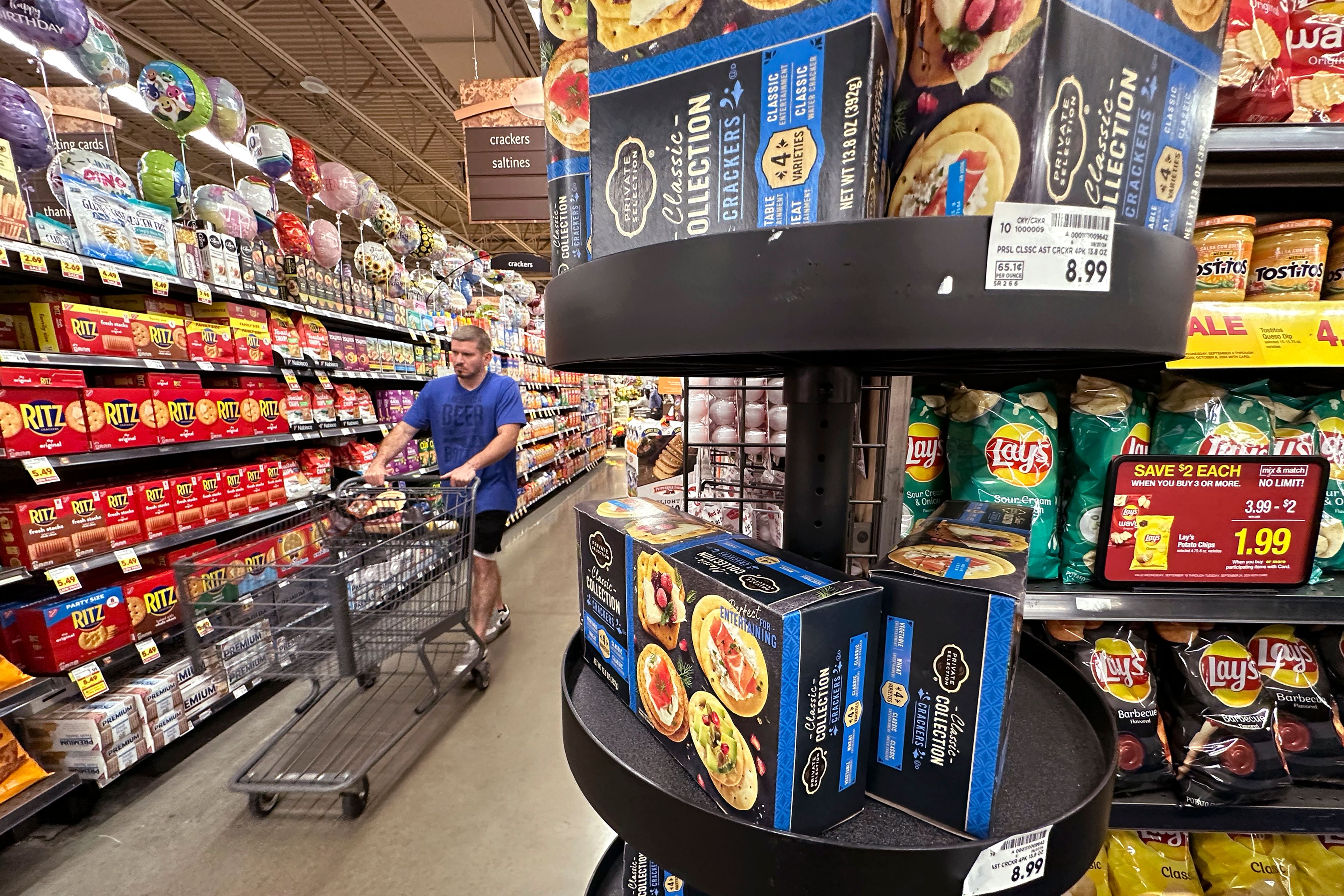 FILE - A customer shops at a grocery store in Chicago, Sept. 19, 2024. (AP Photo/Nam Y. Huh, File)