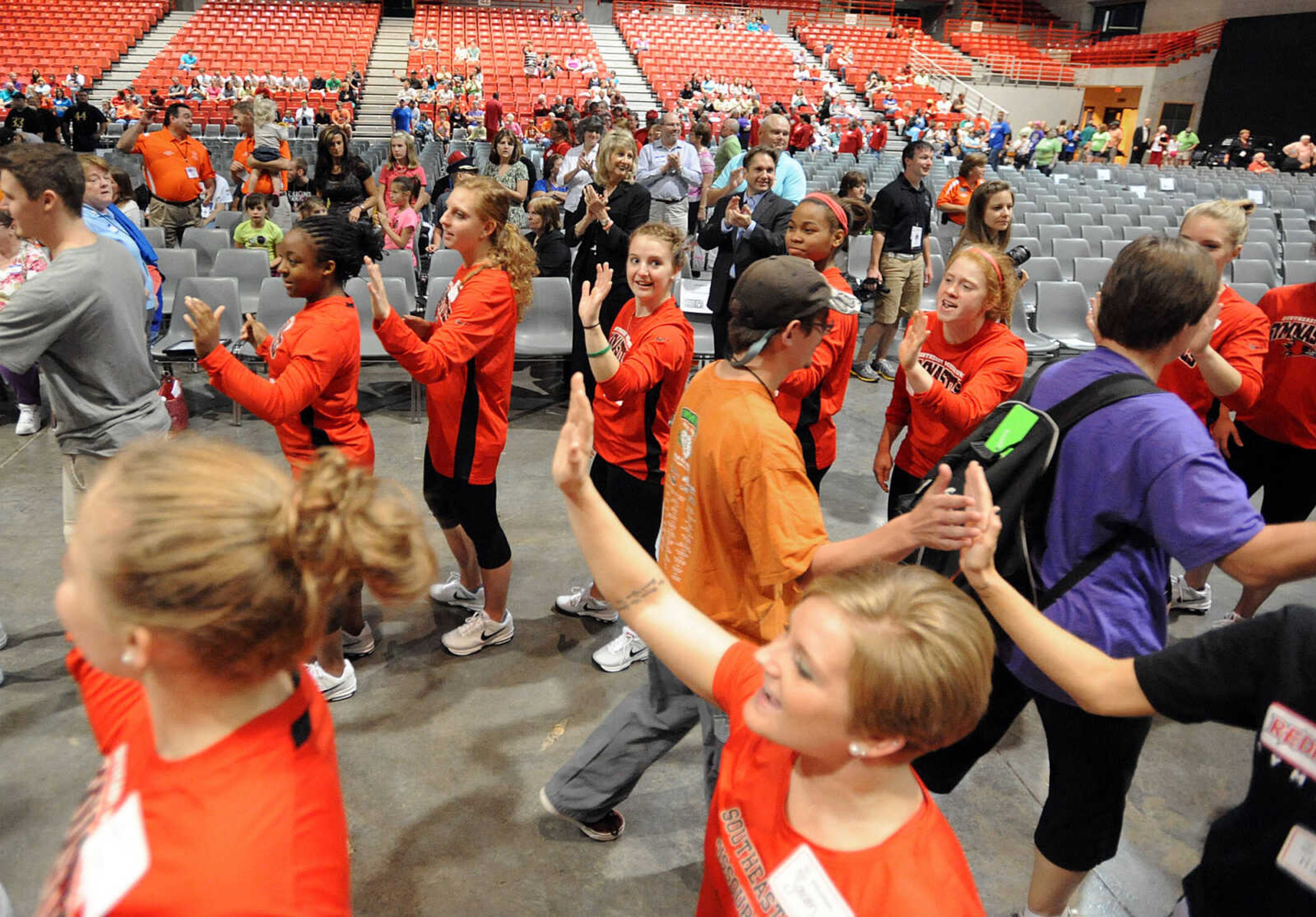 LAURA SIMON ~ lsimon@semissourian.com

Special Olympic athletes are greeted by fans, the Knights of Columbus, and the Southeast Missouri State gymnastics team, Friday, Oct. 11, 2013 during the opening ceremony for the Special Olympics Missouri State Fall Games at the Show Me Center.