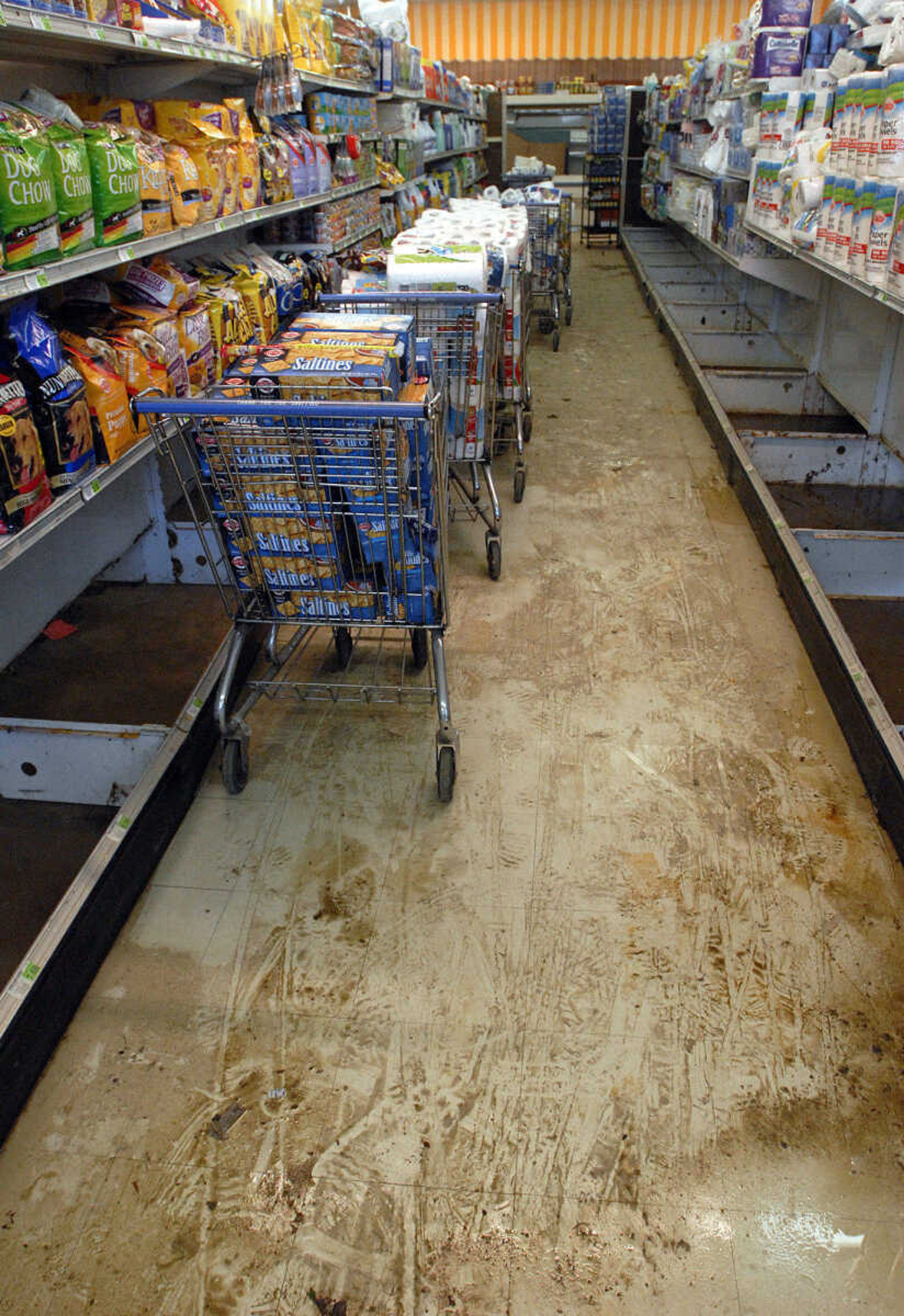 LAURA SIMON~lsimon@semissourian.com
Dirt from floodwater streaks the aisles of Foodtown in Olive Branch, Ill. Thursday, May 5, 2011. The store had 16 inches of water inside when floodwaters were at their highest.