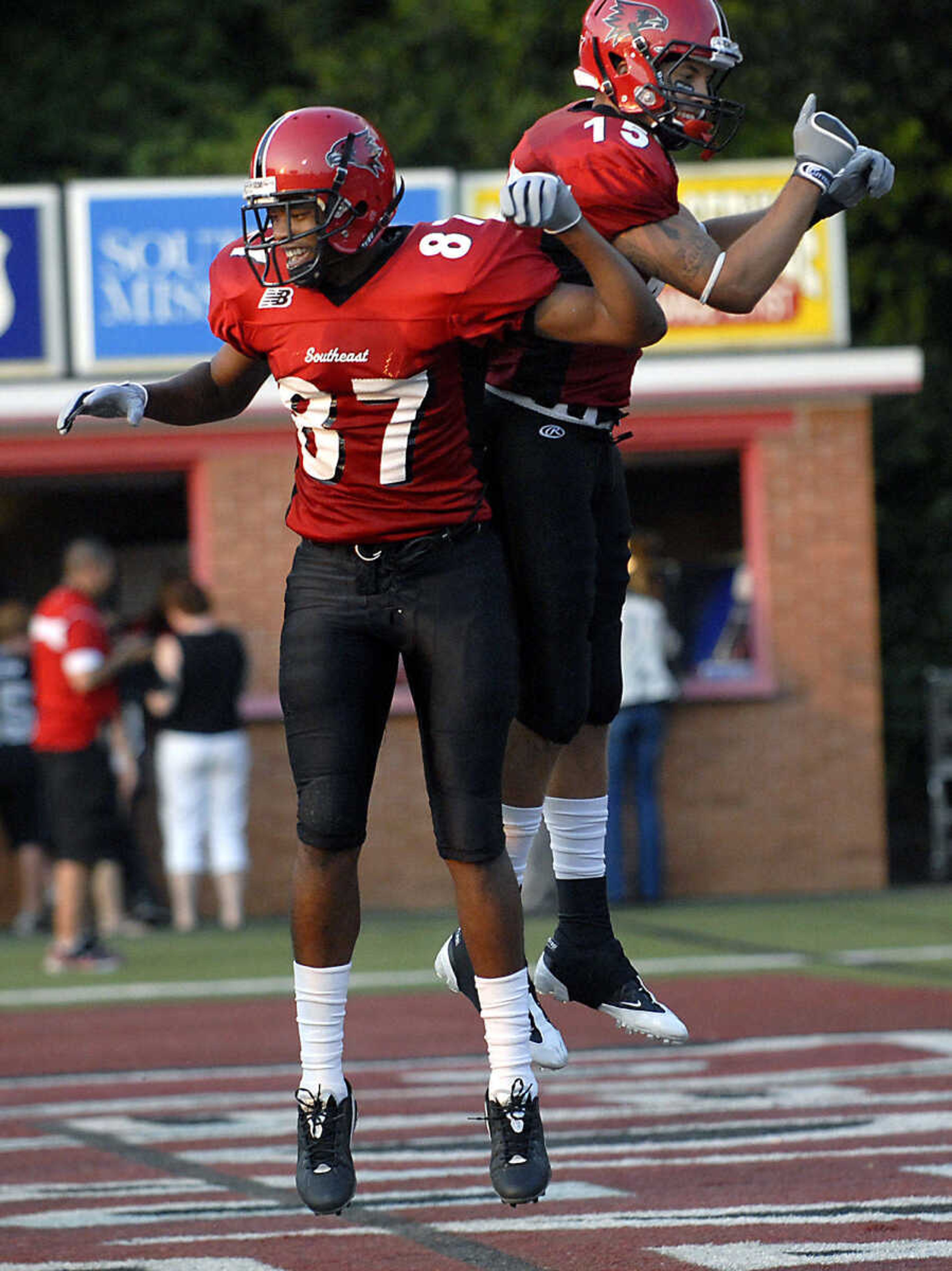 KIT DOYLE ~ kdoyle@semissourian.com
Redhawks receivers Miles Edwards, left, and Walter Peoples celebrate Peoples' touchdown catch Thursday, September 3, 2009, in the season opener at Houck Stadium.