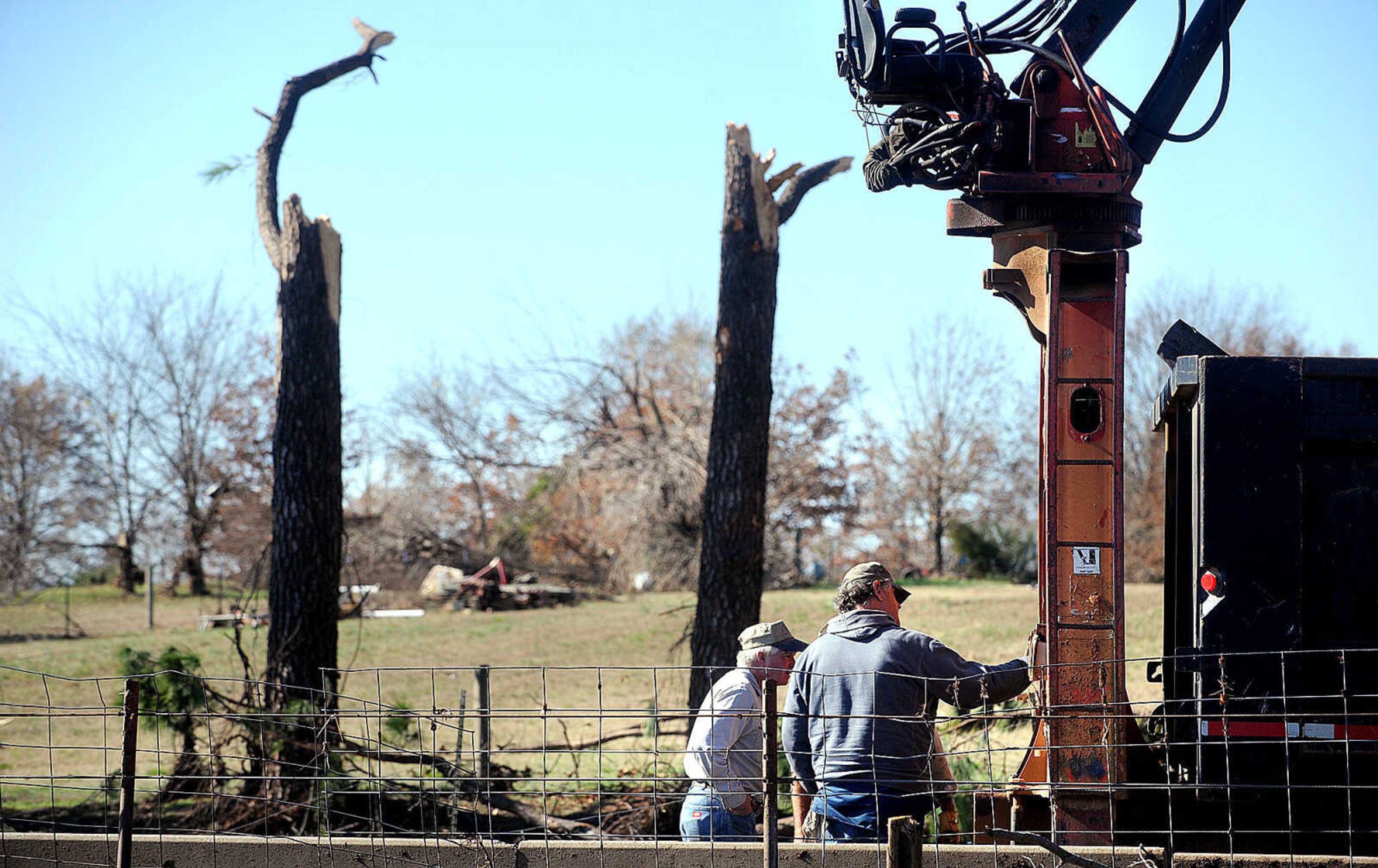 LAURA SIMON ~ lsimon@semissourian.com

Cleanup efforts from Sunday's storm are underway at Vince Draper's cattle farm, Monday, Nov. 18, 2013, southeast of Morley, Mo.