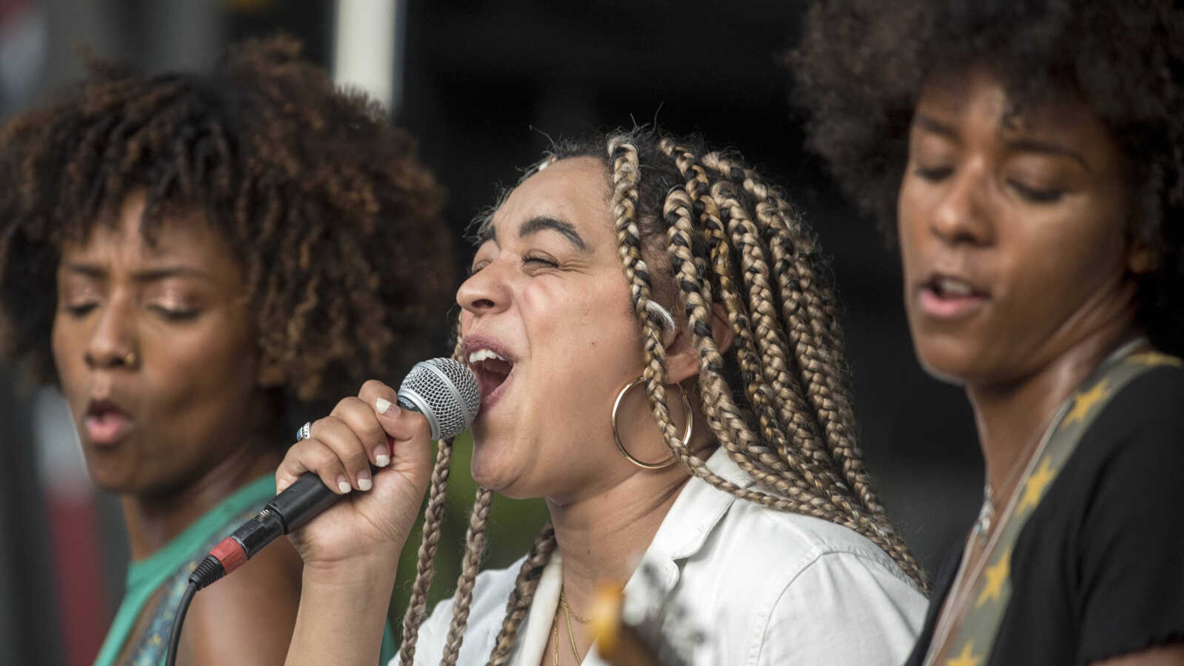 Members of the New Respects, from left, Alexis Fitzgerald, Jasmine Mullin and Alexandria Fitzgerald perform during the second-annual Shipyard music festival Saturday, Sept. 28, 2019, at Ivers Square in Cape Girardeau.