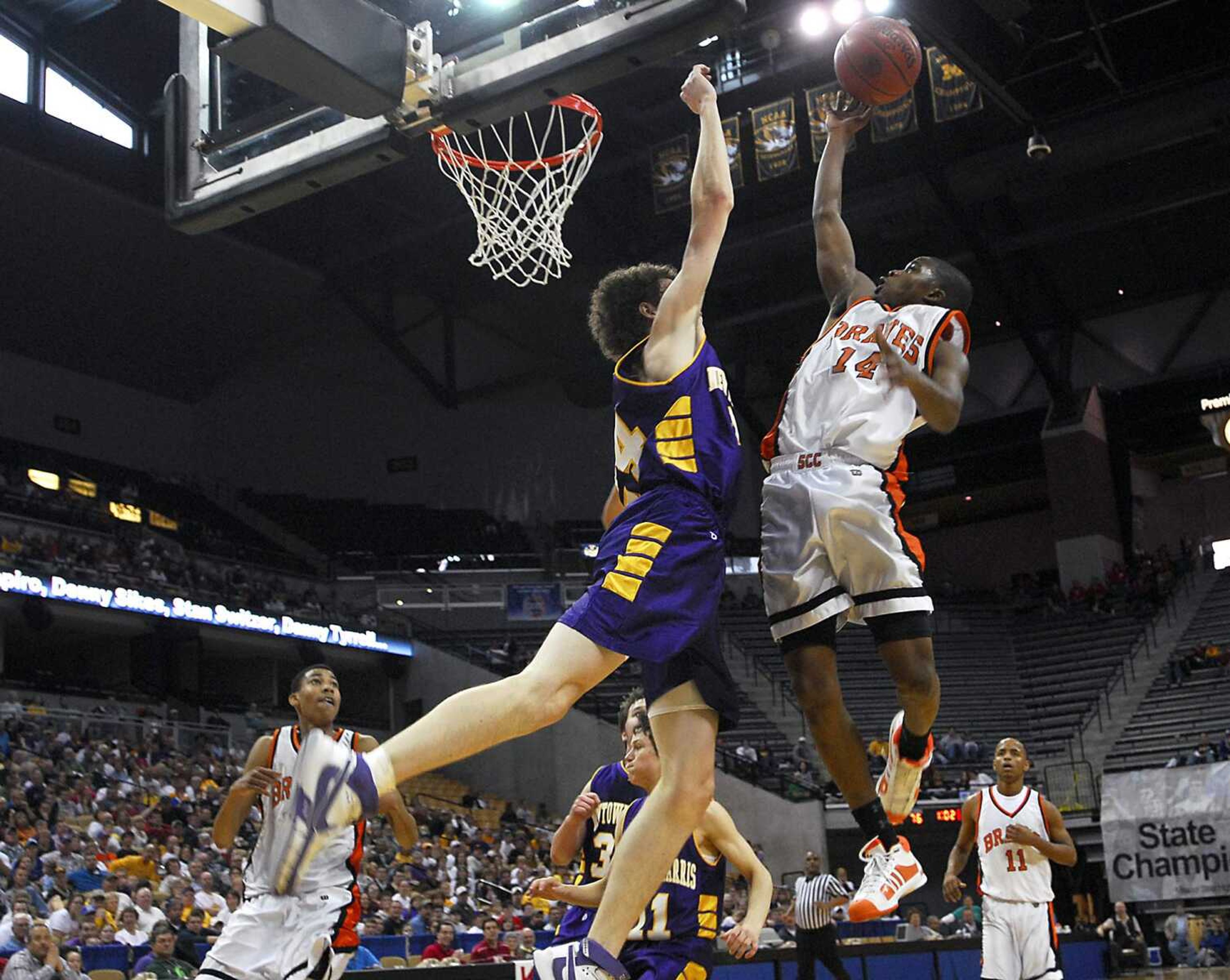 KIT DOYLE ~ kdoyle@semissourian.com
Braves junior Bobby Hatchett scores over Newtown-Harris defender Justin Ralls Saturday, March 21, 2009, during the Class 1 state championship at Mizzou Arena in Columbia.