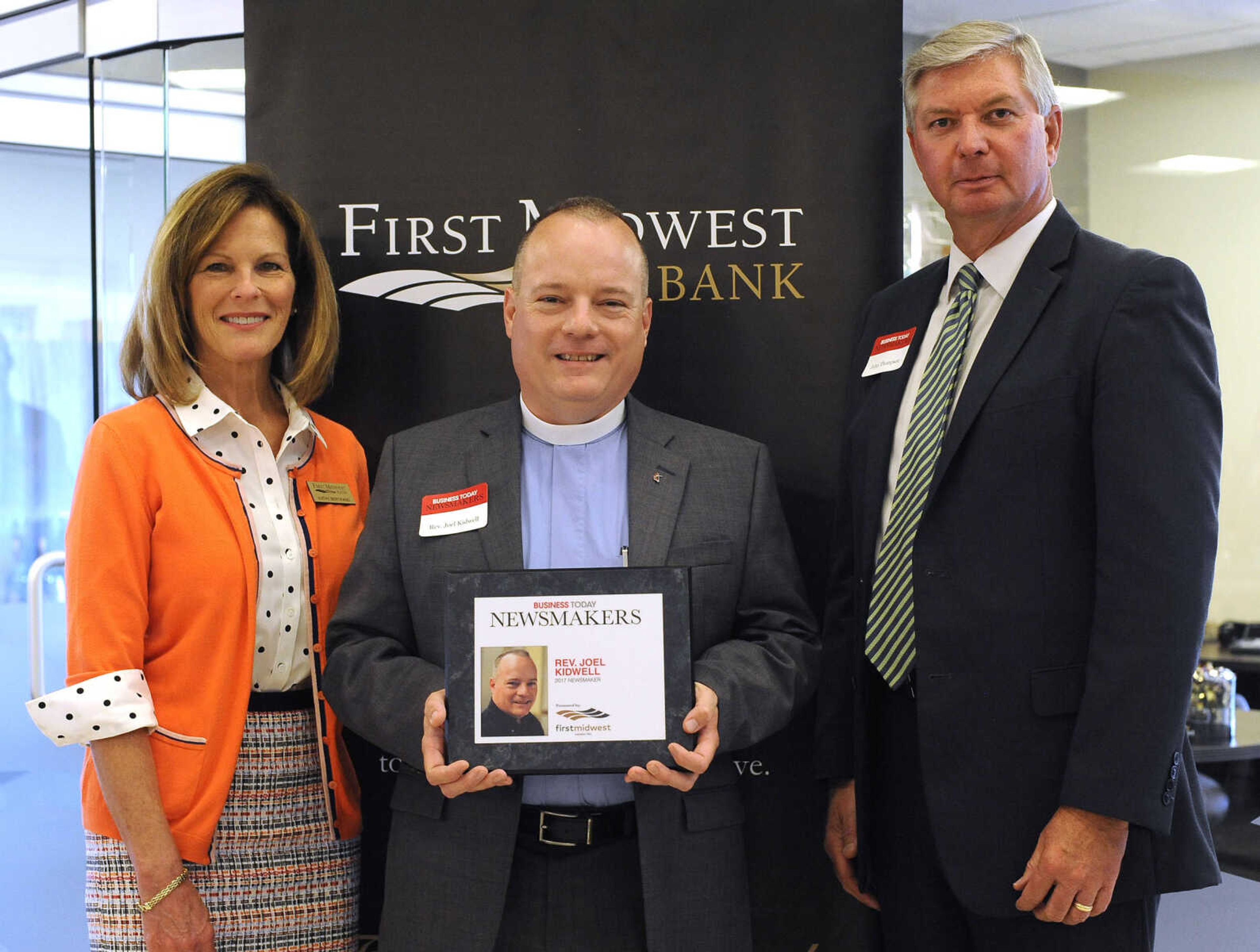 FRED LYNCH ~ flynch@semissourian.com
The Rev. Joel Kidwell poses for a photo with Kathy Bertrand, First Midwest Bank community bank president, Cape Girardeau, and John N. Thompson, First Midwest Bank community bank president, Jackson, Wednesday, Sept. 6, 2017 during the Business Today Newsmakers awards reception at First Midwest Bank in Cape Girardeau.