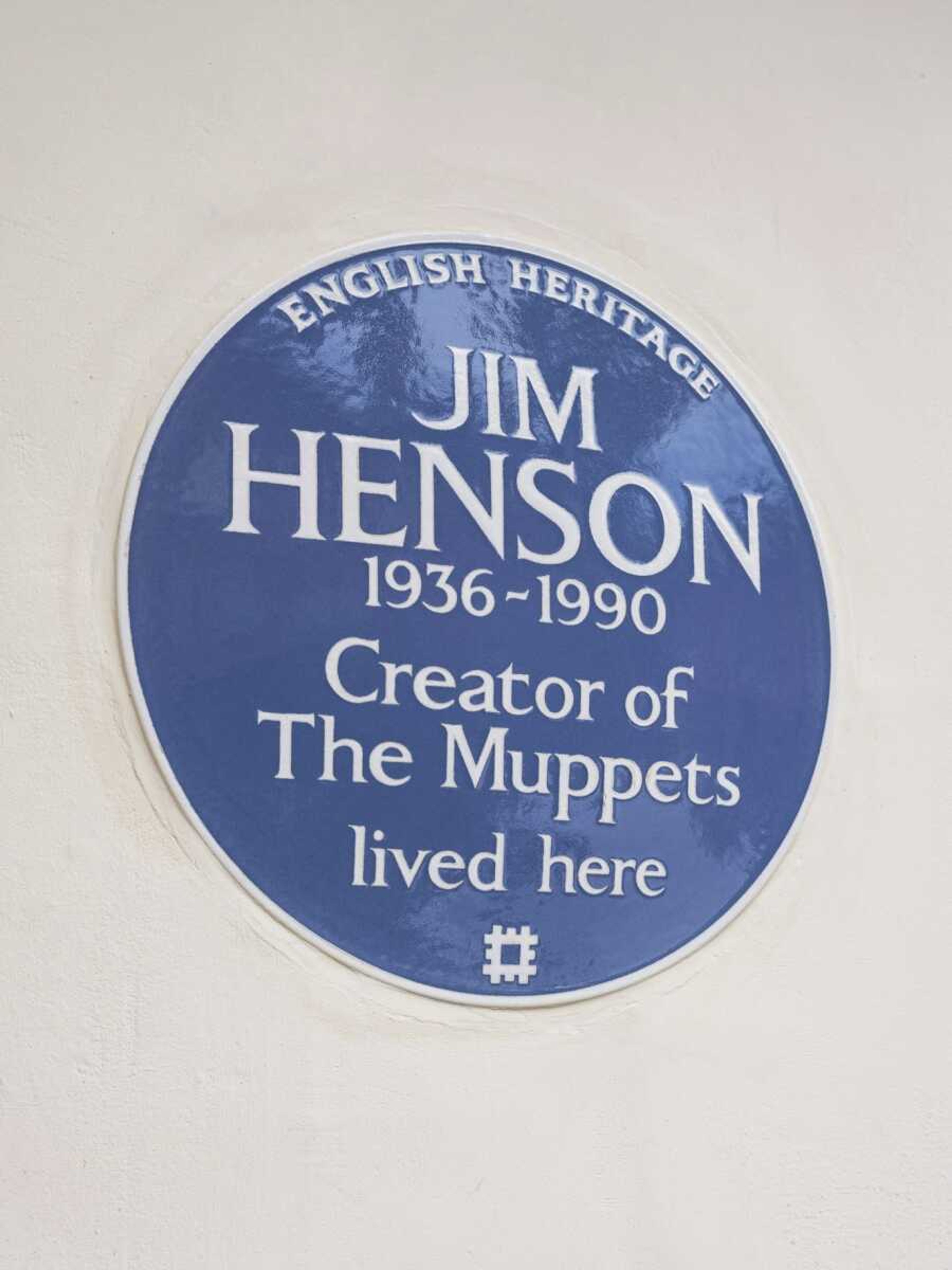 Muppets creator Jim Henson was honored Tuesday with a blue plaque at his former home in London.