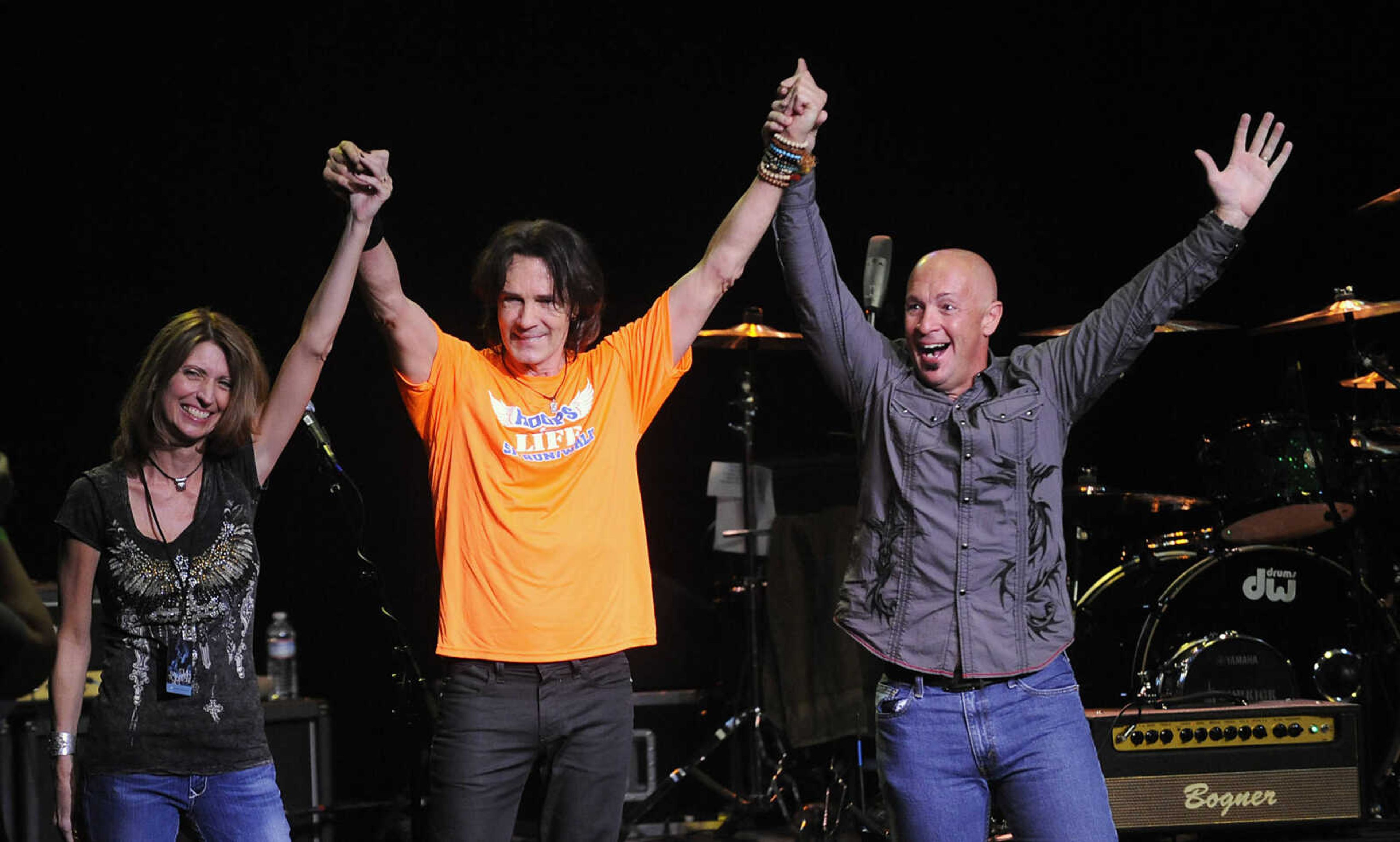 Rick Springfield brings out Amy and Shannon Aldridge after performing Saturday, July 21, at the Bedell Performance Hall at the River Campus as part of a fundraiser for Hoops for Life. All of the proceeds will benefit pediatric brain tumor research in memory of Amy and Shannon's daughter, Sahara "Hoops" Aldridge. The 13-year-old Cape Girardeau resident lost her battle with brainstem glioma Nov. 5, 2007.