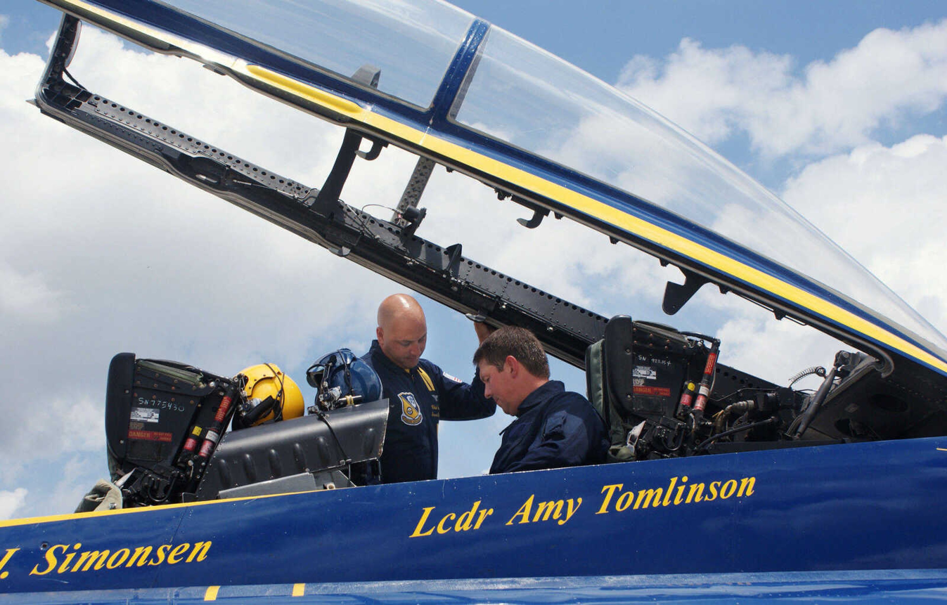 BAILEY REUTZEL ~ breutzel@semissourian.com

Rob Bunger, right, gets strapped into the Blue Angels' F/A-18 by #7 Crew Chief Chad Swanson at the Cape Girardeau Airport on Wednesday, June 16, 2010. Bunger was one of three area people who got the chance to fly with the Blue Angels on Wednesday.