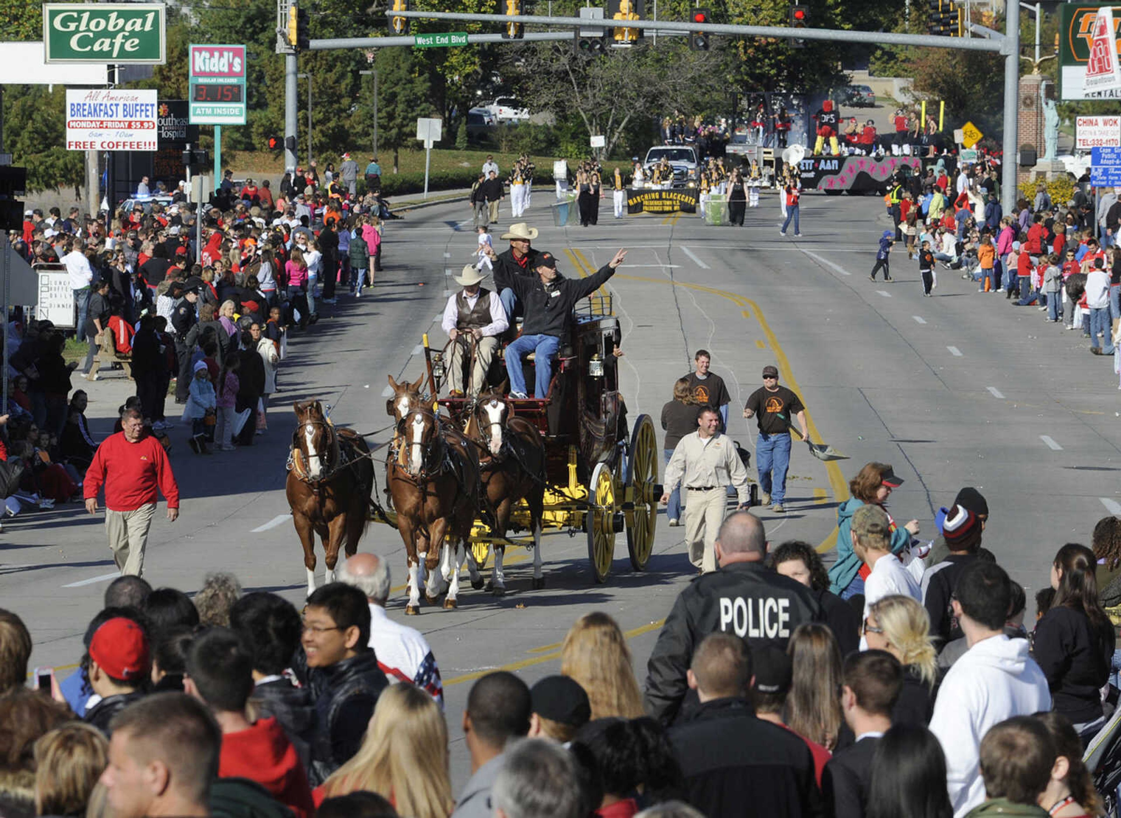 Horses pull a Wells Fargo stagecoach in the parade.