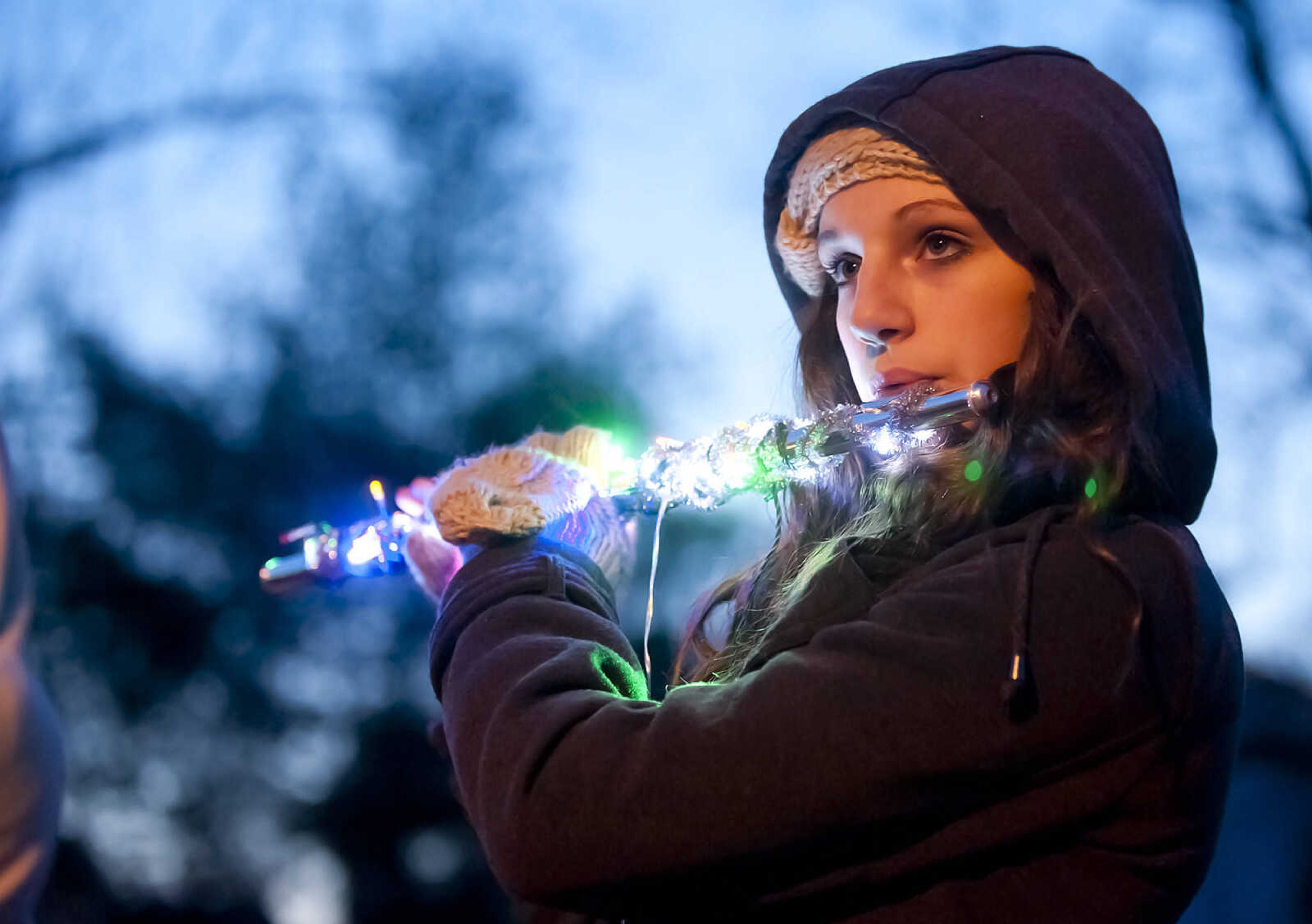 Holly James, 13, warms up with the Advance High School Marching Band before the 22nd Annual Parade of Lights Sunday, Dec. 1, in Cape Girardeau. The parade started at Capaha Park making its way down Broadway and Main Street. The theme for this year's parade was ŇChristmas Fun for Everyone.Ó