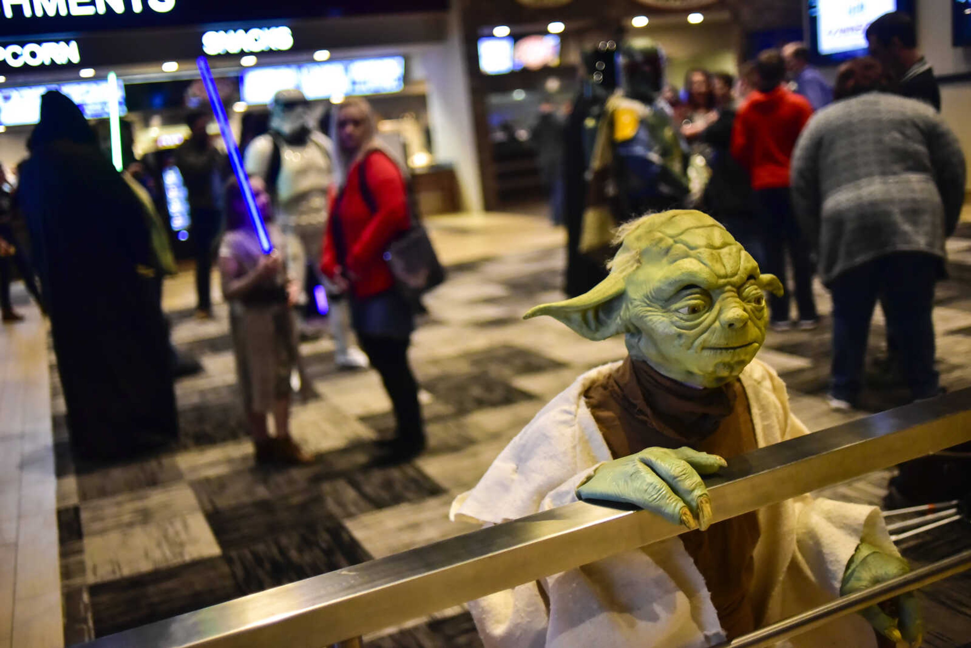 Trey Kerley as Yoda with the Southern Illinois Jedi Order waits in the lobby before the showing of Star Wars: The Last Jedi Thursday, Dec. 14, 2017 at Cape West Cinema in Cape Girardeau.