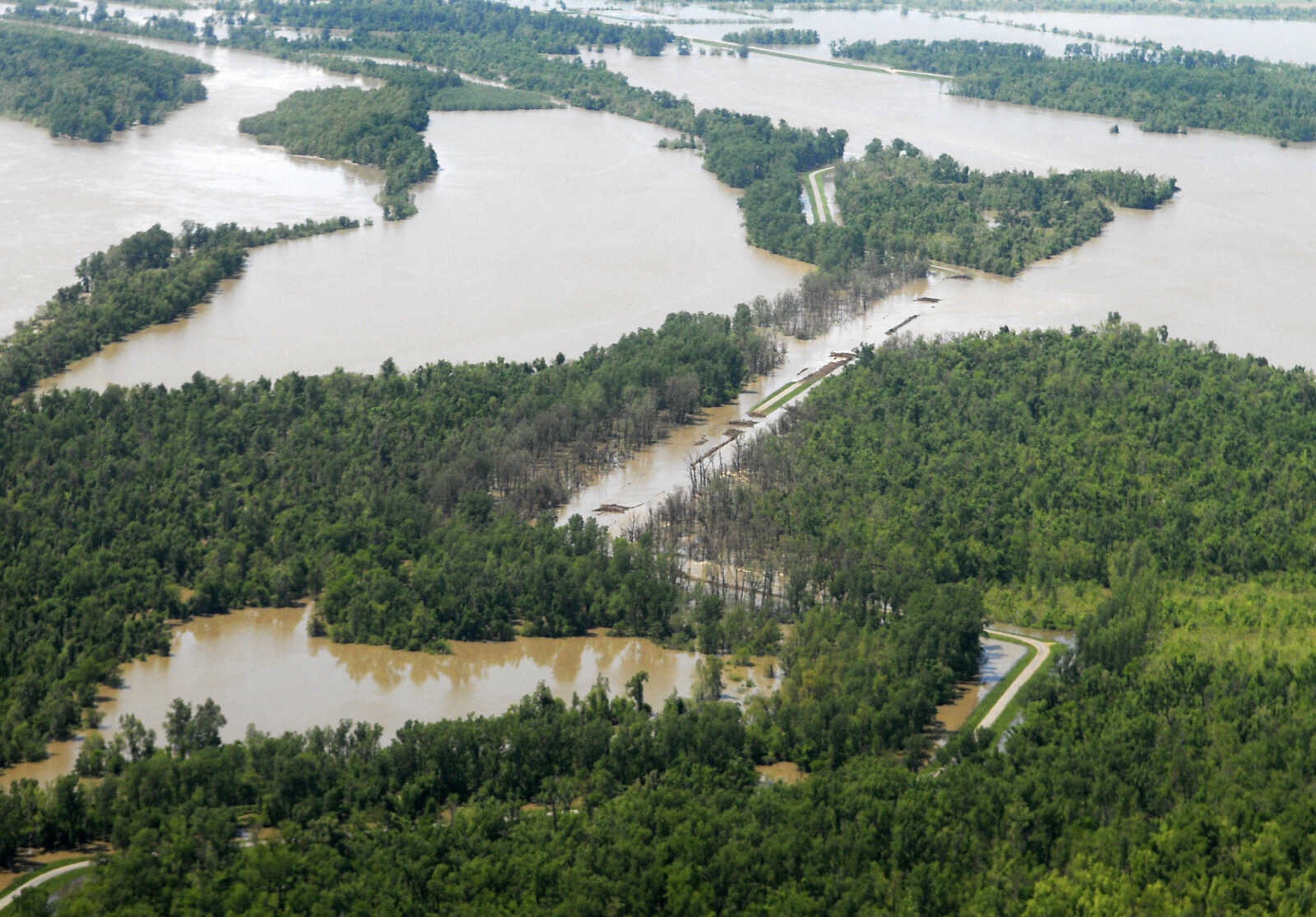 KRISTIN EBERTS ~ keberts@semissourian.com

Water flows over the breached section of levee near New Madrid, Mo., after it was intentionally breached on Tuesday, May 3, 2011. On May 2, Maj. Gen. Michael Walsh gave the order to activate the Birds Point-New Madrid floodway, covering over 130,000 acres of farmland to ease flooding upstream.