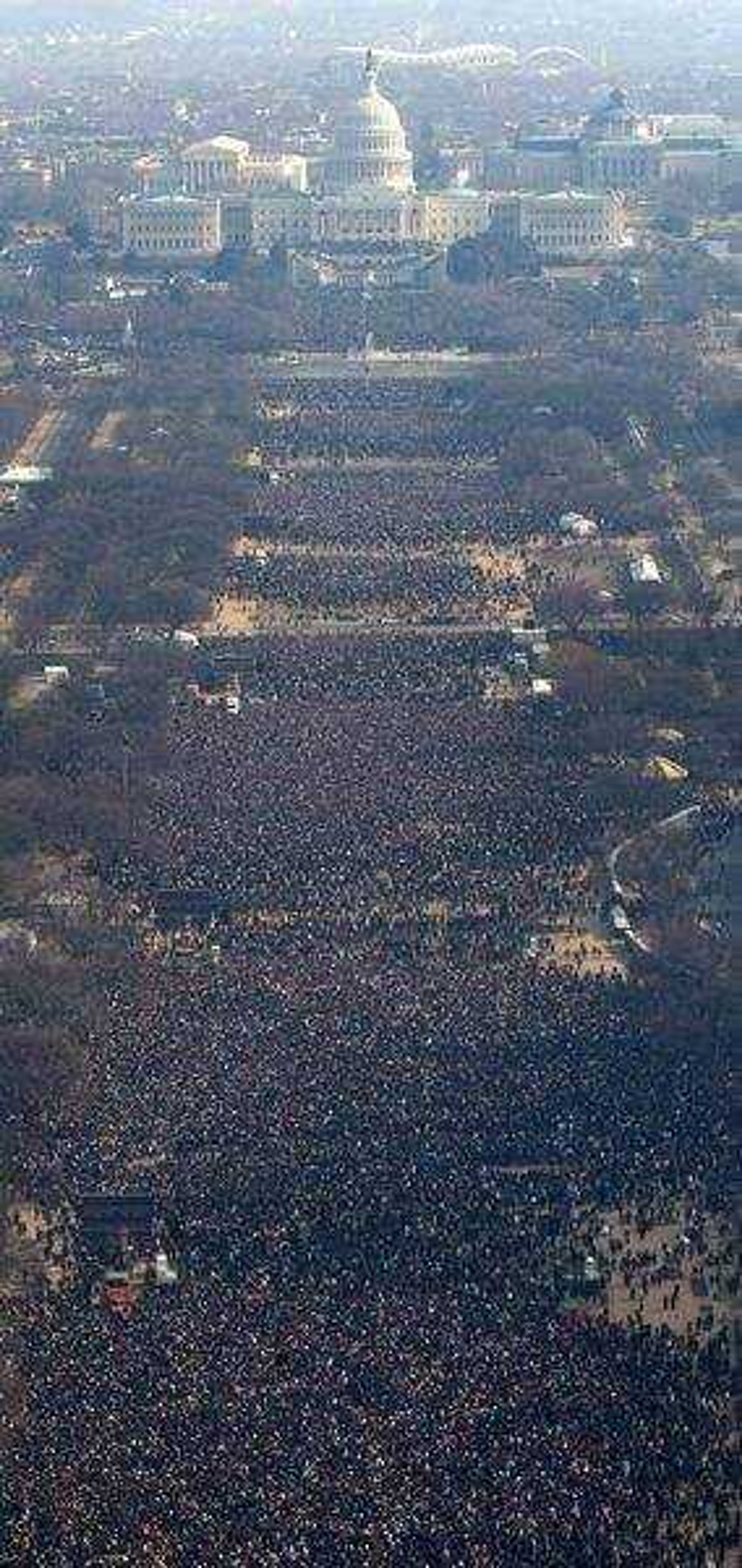 Crowds take part in the inauguration of President-elect Barack Obama along the National Mall during the swearing-in ceremony Tuesday, Jan, 20, 2009, in Washington. (AP Photo/Luis M. Alvarez)