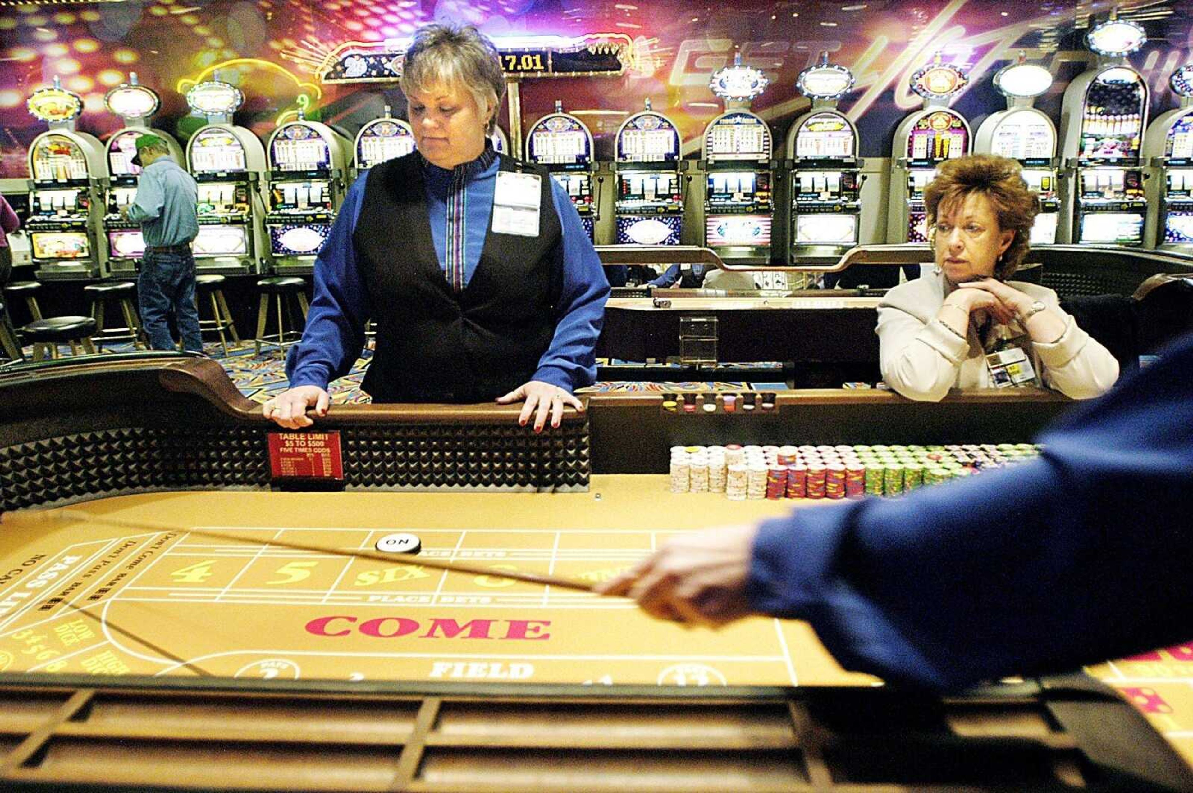 Cheryl Jansen, left, and Sue Smith worked at the craps table at the Casino Aztar in Caruthersville, Mo., in 2007. (Diane L. Wilson)