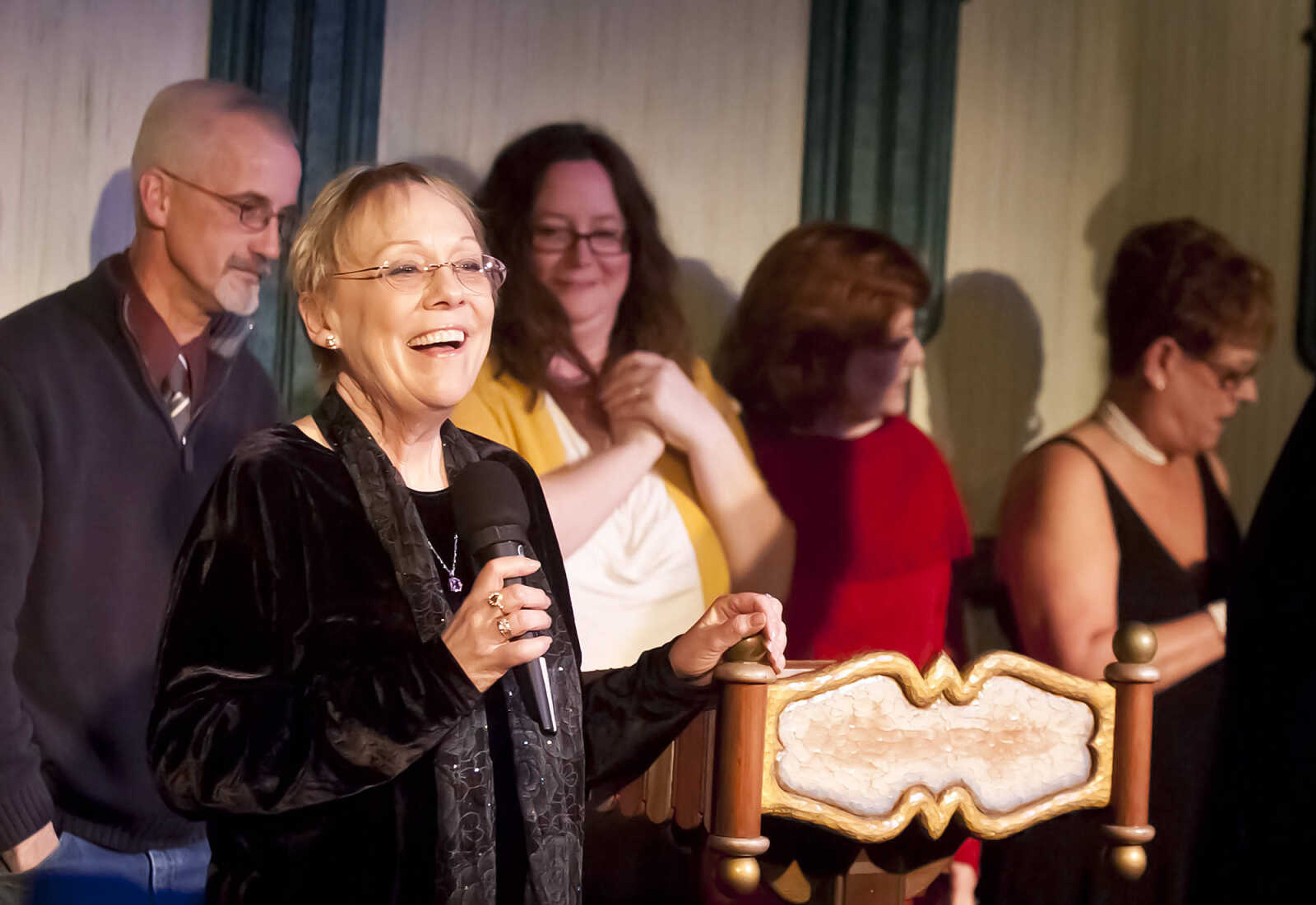 Roseanna Whitlow-Greenwood speaks as the cast of "Strawberry Ridge," gather on stage to be recognized for the Best Show Award during the Abbott Awards, River City Players' annual awards ceremony, Saturday, Jan. 18, at Port Cape in downtown Cape Girardeau. Whitlow-Greenwood wrote and directed the play. Auditions for the first production of the 2014 season, "Quiet on the Set," will be held at 7 p.m. Jan. 29 and 30 at Port Cape.