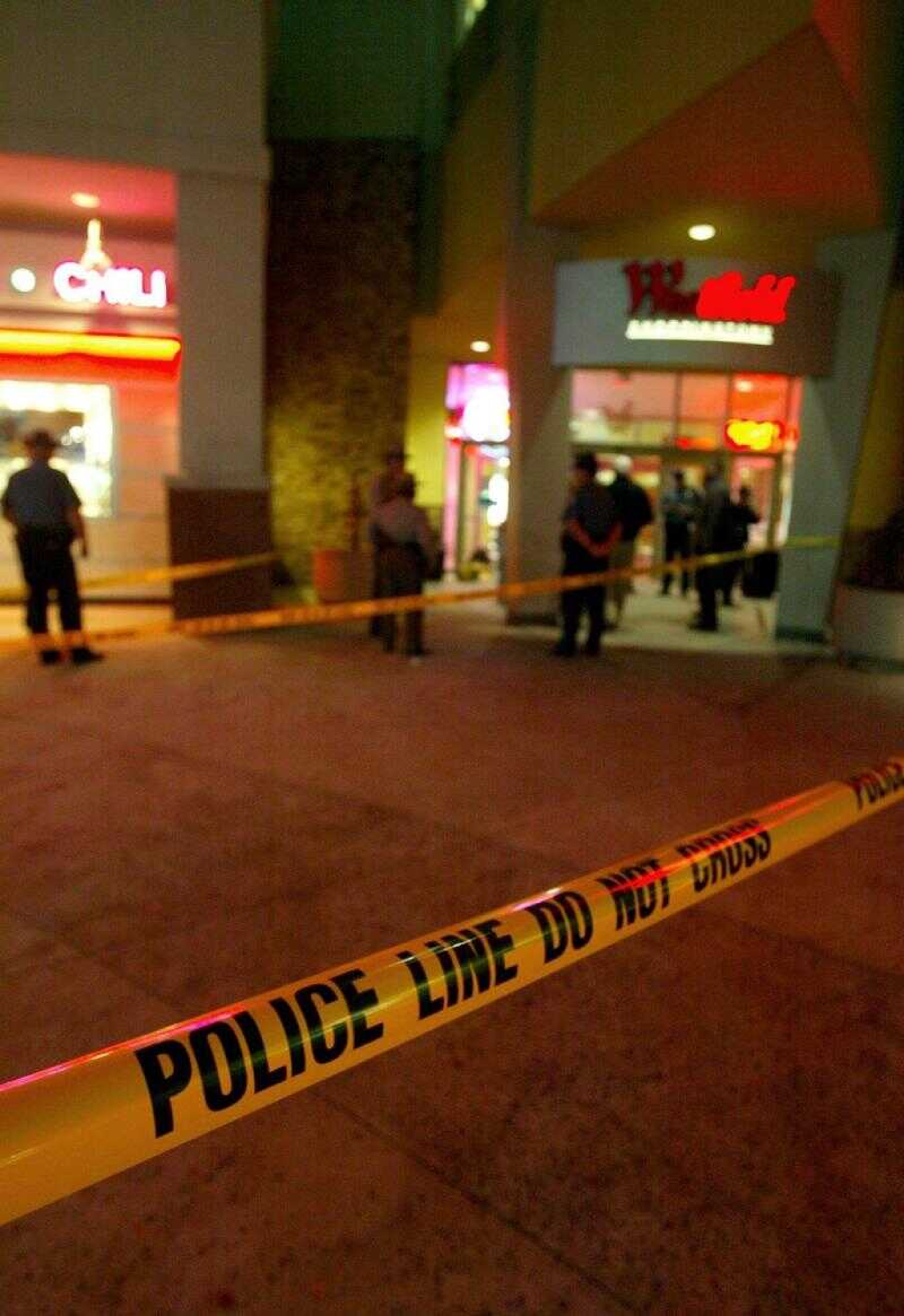 Anne Arundel County officers investigate the crime scene at Westfield Annapolis Mall, Friday in Annapolis, Md. Three people were shot during what appeared to be a gangland-style confrontation in the food court of the shopping mall Saturday evening, and one was critically wounded.
