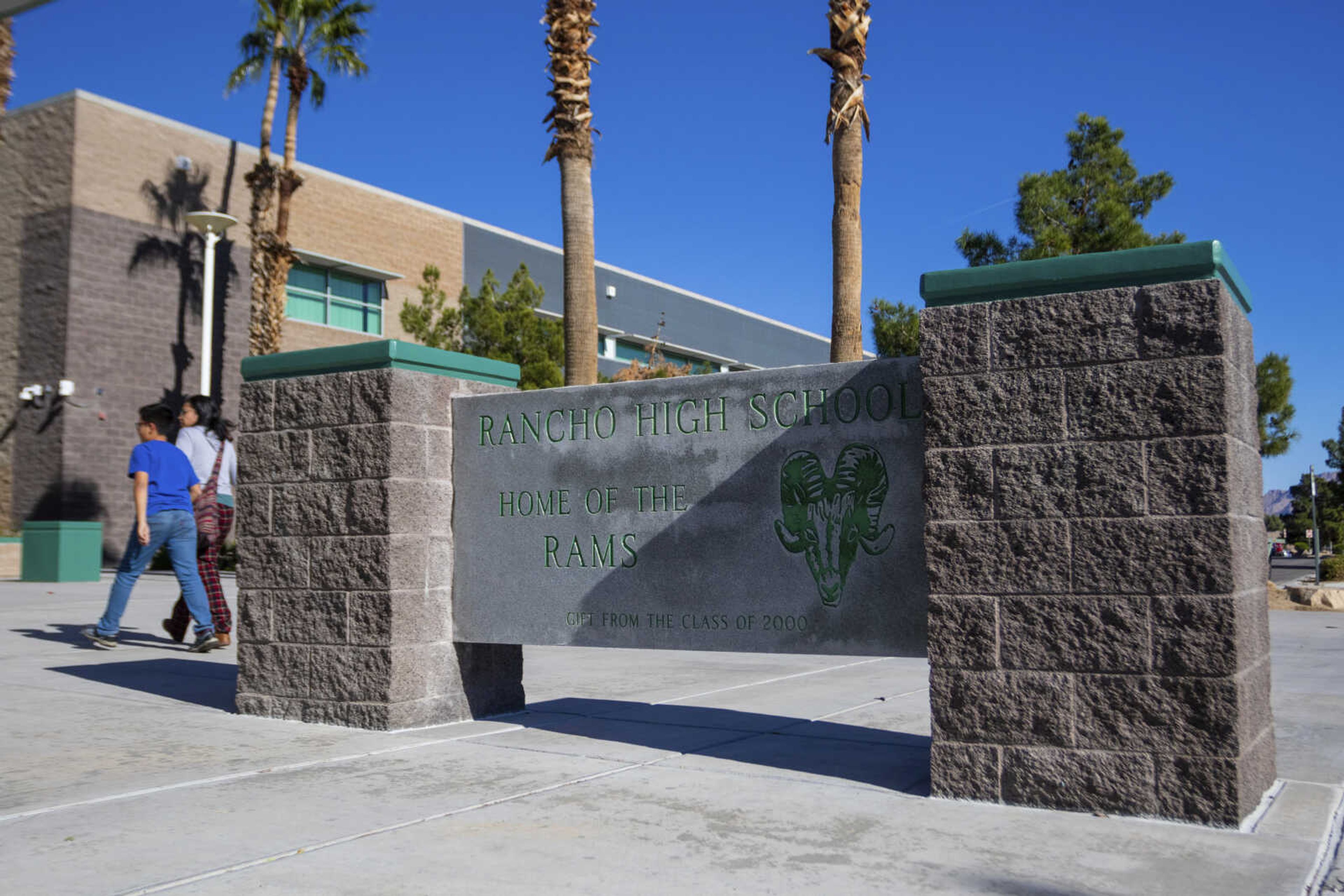 The main entrance to Rancho High School in eastern Las Vegas, onTuesday, Nov. 21, 2023. Authorities have arrested at least eight students in connection with the beating of Jonathan Lewis Jr., who died a week after a prearranged fight over a pair of headphones and a vape pen. (AP Photo/Ty O Neil)