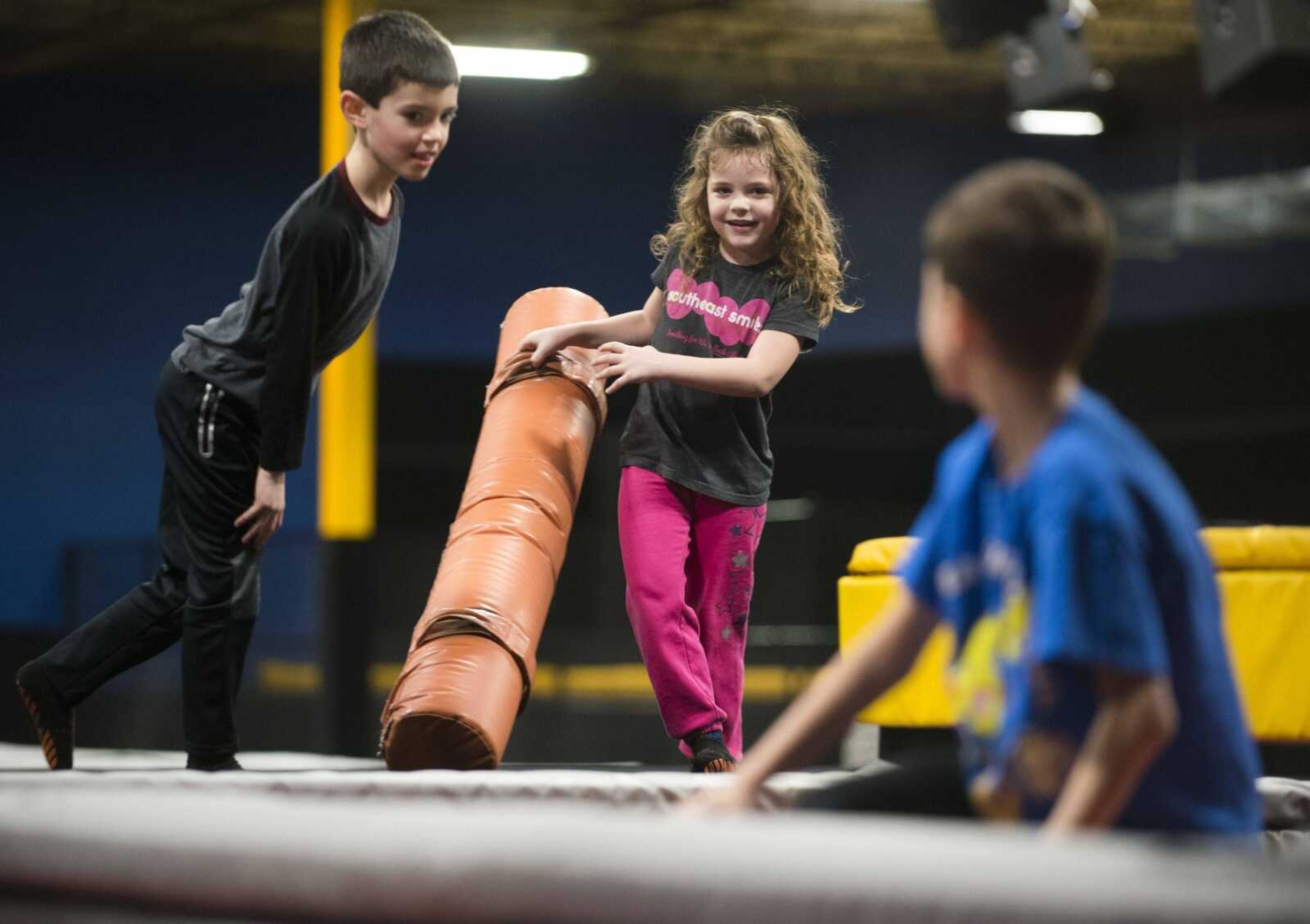 Skylar Martin, 5, center, plays with Emmett Griffin, 7, left, and Jackson Mau, 9, right, during an Easterseals Midwest monthly outing Tuesday, Feb. 13, 2018, at Ultimate Air Trampoline Park in Scott City.