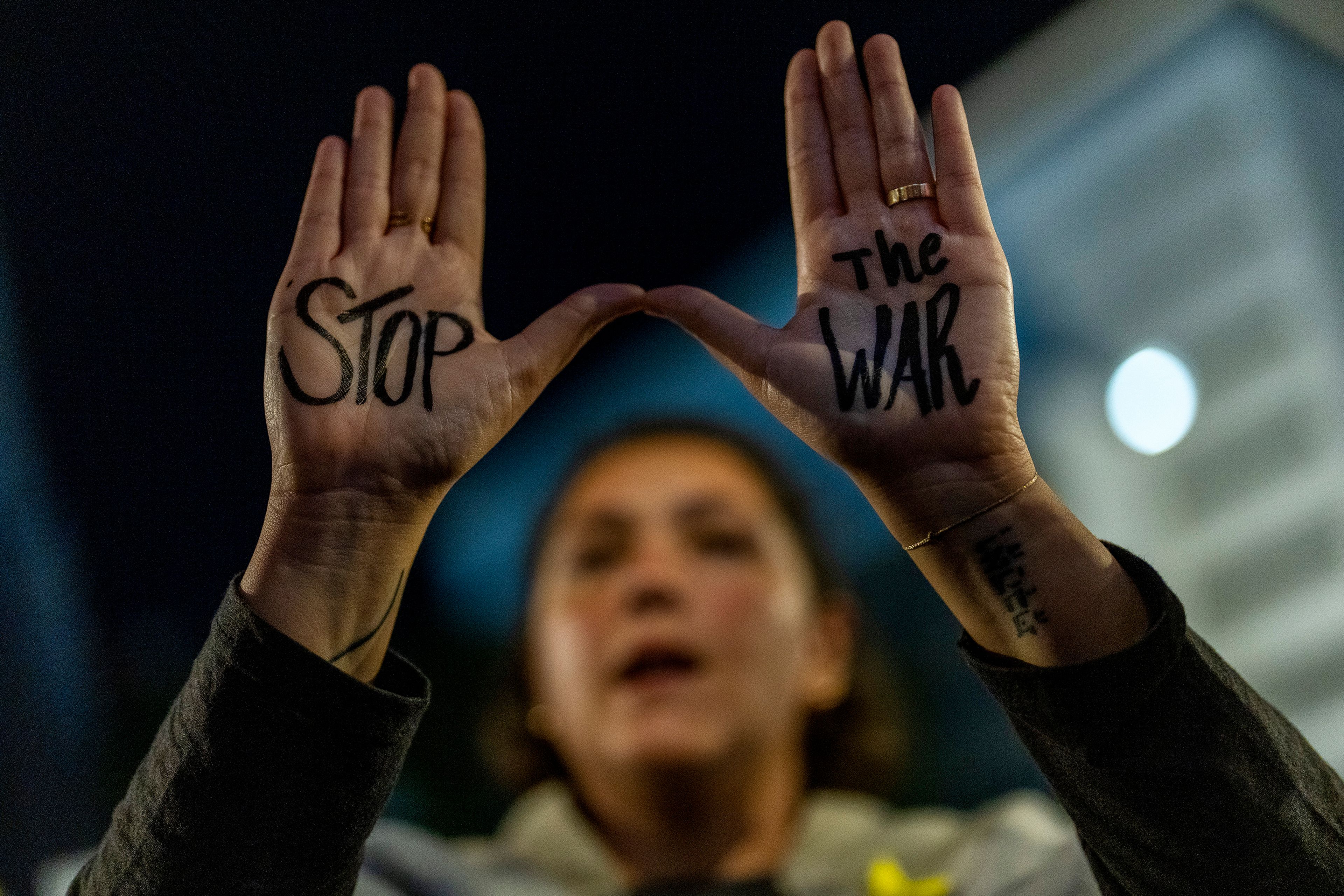 A woman shouts slogans during a protest against Prime Minister Benjamin Netanyahu's government and call for the release of hostages held in the Gaza Strip by the Hamas militant group, in Tel Aviv, Israel, Saturday, Nov. 16, 2024. (AP Photo/Francisco Seco)