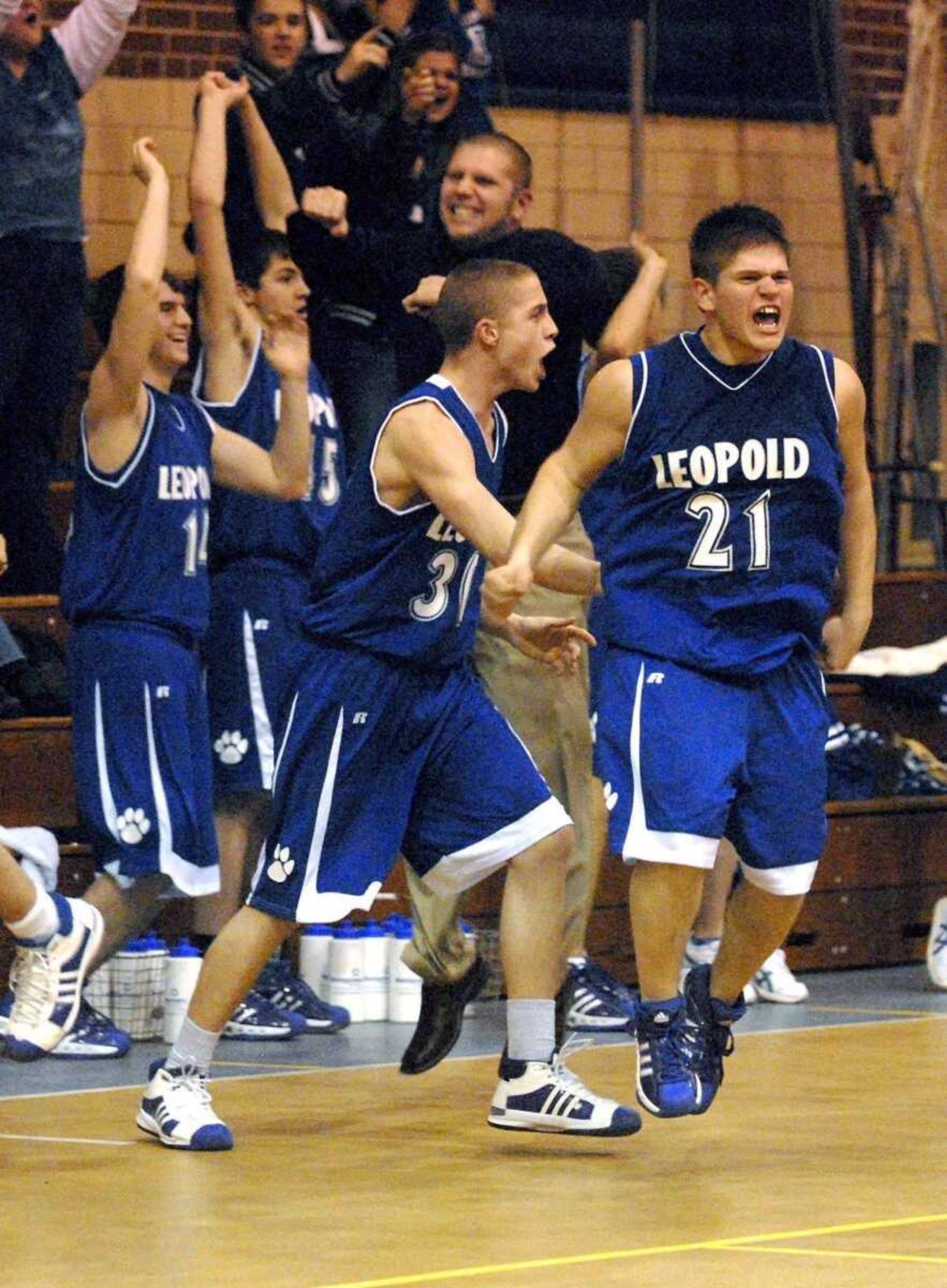 ELIZABETH DODD ~ edodd@semissourian.com<br>Leopold's Wade Wiseman, right, celebrates with his teammates after defeating St. Vincent 49-48 in the final seconds of their game Thursday at St. Vincent High School in Perryville.