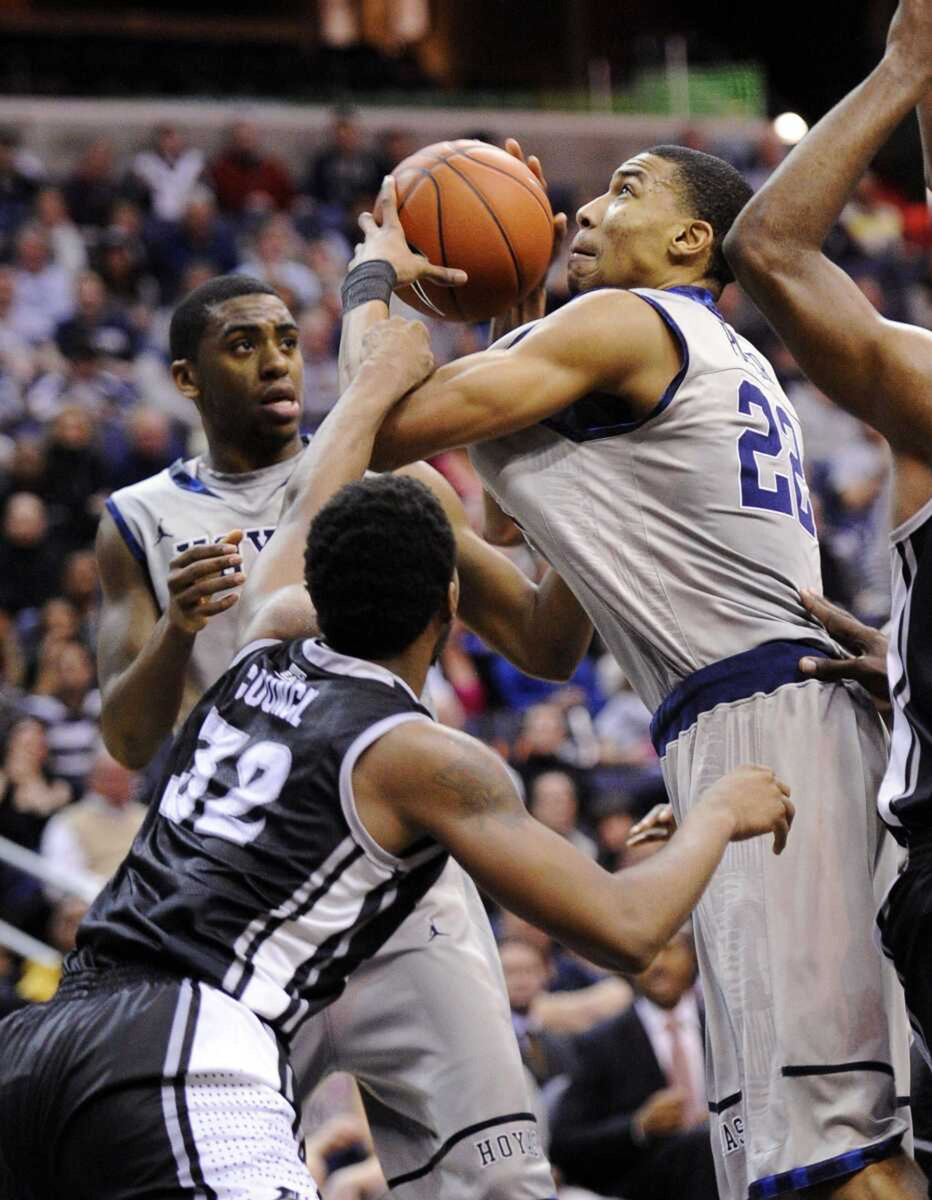 Providence guard Vincent Council grabs Georgetown freshman Otto Porter during the second half of their game Saturday in Washington. Georgetown won 49-40. Porter, who helped Scott County Central to three Class 1 state championships while in high school, is the Hoyas' leading rebounder this season. (Nick Wass ~ Associated Press)