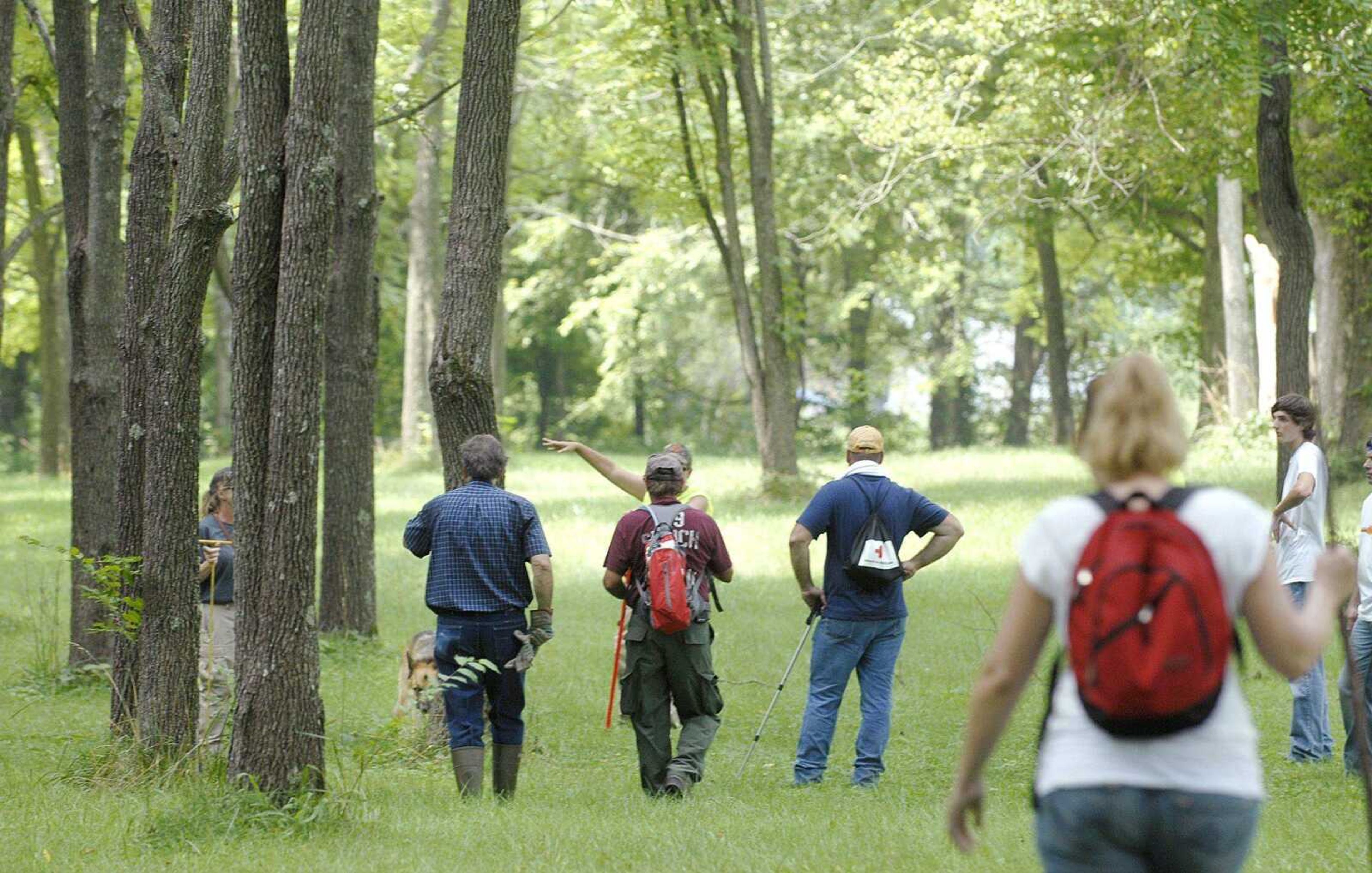 Around 100 people turned out Saturday, July 16, 2011 to search for Jacque Waller. Waller, the mother of triplets, has been missing since June 1. Saturday's 88 acre search in rural Cape Girardeau County included the Scott County search and rescue K-9 unit with 3 search dogs and five locals on horseback to search the thicker terrain. The K-9 unit volunteered their services in collaboration with Christy Dabis with the Cue Center for Missing Persons out of North Carolina. The volunteers were split into teams, each canvassing predetermined areas of interest. (Laura Simon)