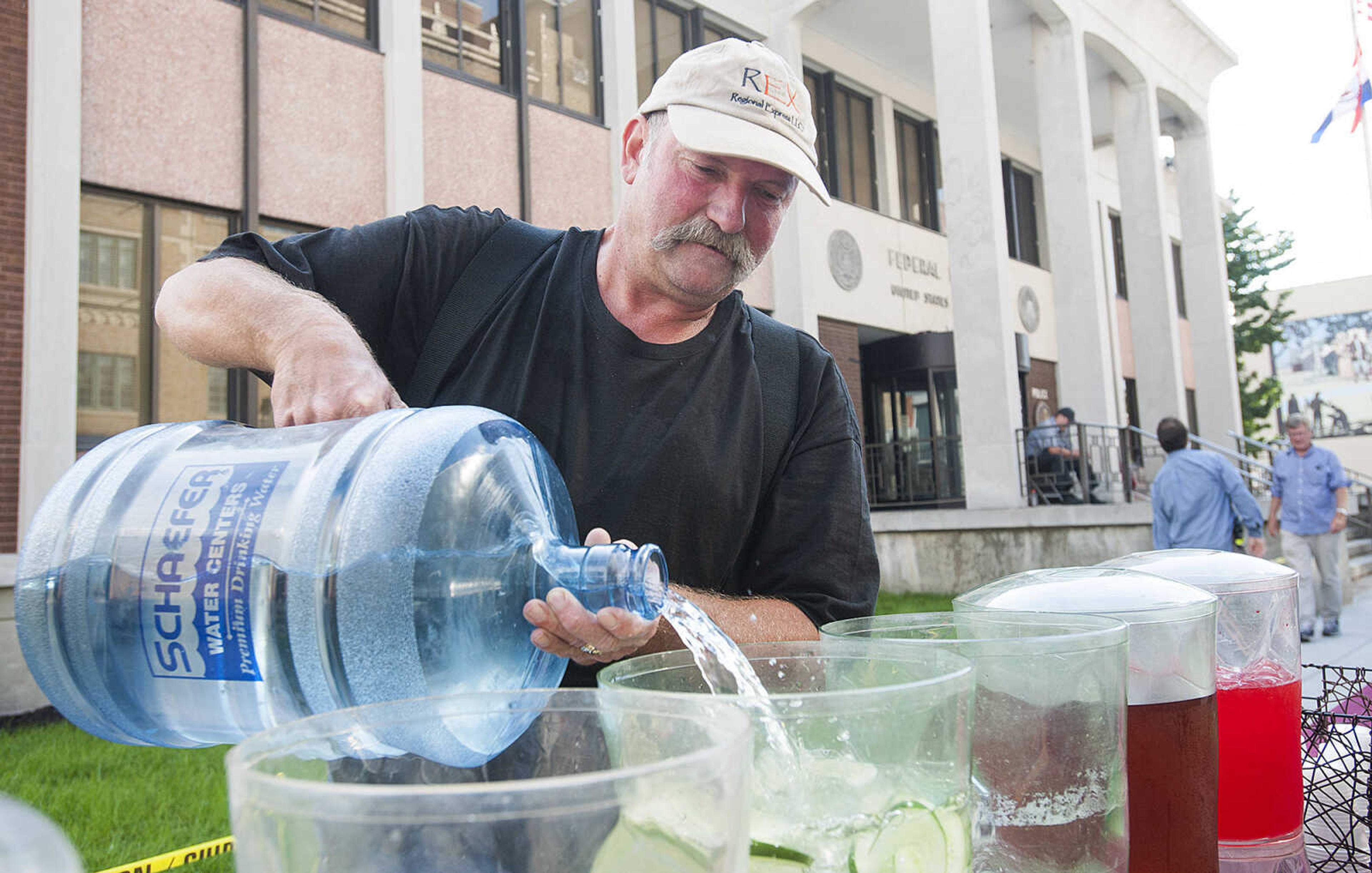 ADAM VOGLER ~ avogler@semissourian.com
Kendall Clayton of Cape Girardeau fills beverage dispensers Thursday, Oct. 3. For Stars Catering, which is based in Carlsbad N. M., is serving meals to up to 120 members of the cast and crew of the 20th Century Fox feature film "Gone Girl," each day.