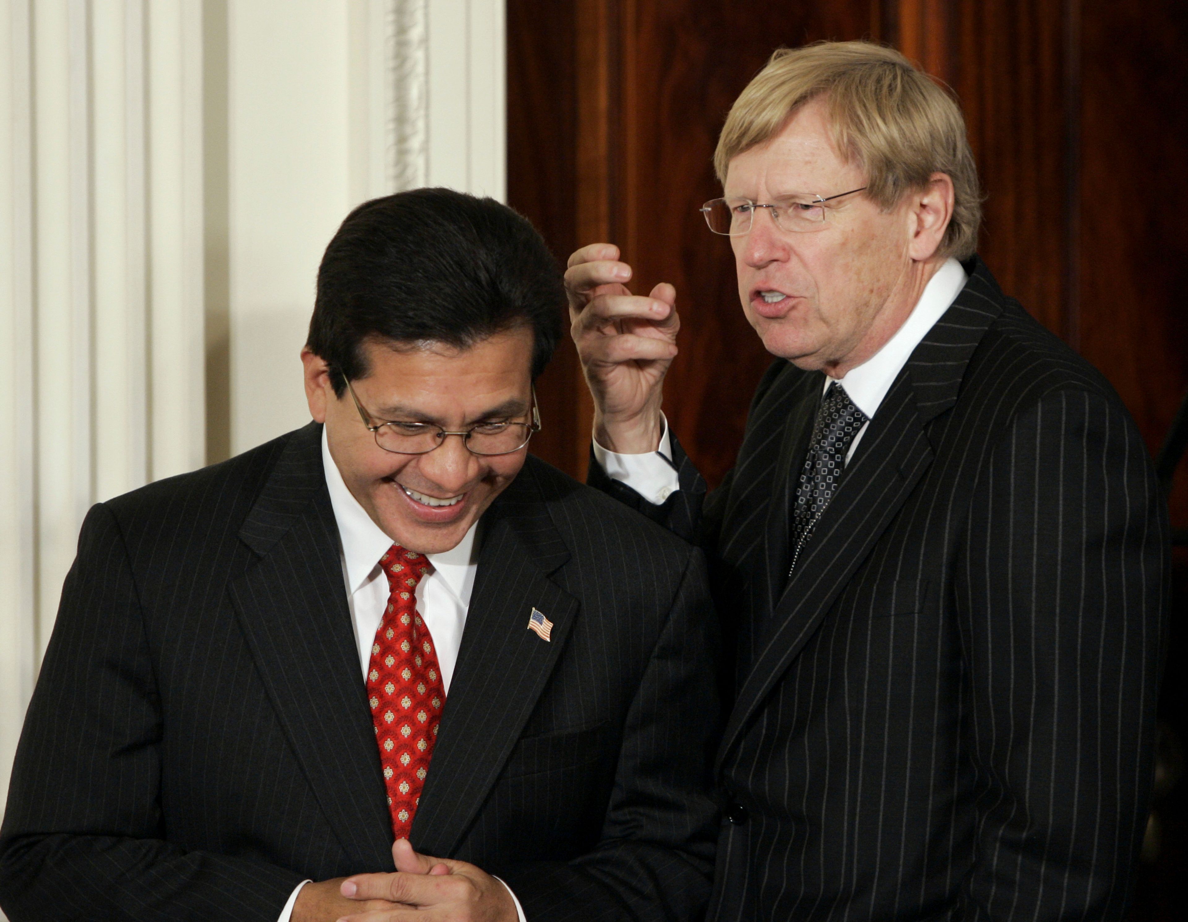 FILE - Attorney General Alberto Gonzales, left, talks with former Solicitor General Ted Olson, before President Bush delivers a speech on terrorism in the East Room of the White House in Washington, Sept. 6, 2006. (AP Photo/Gerald Herbert, File)