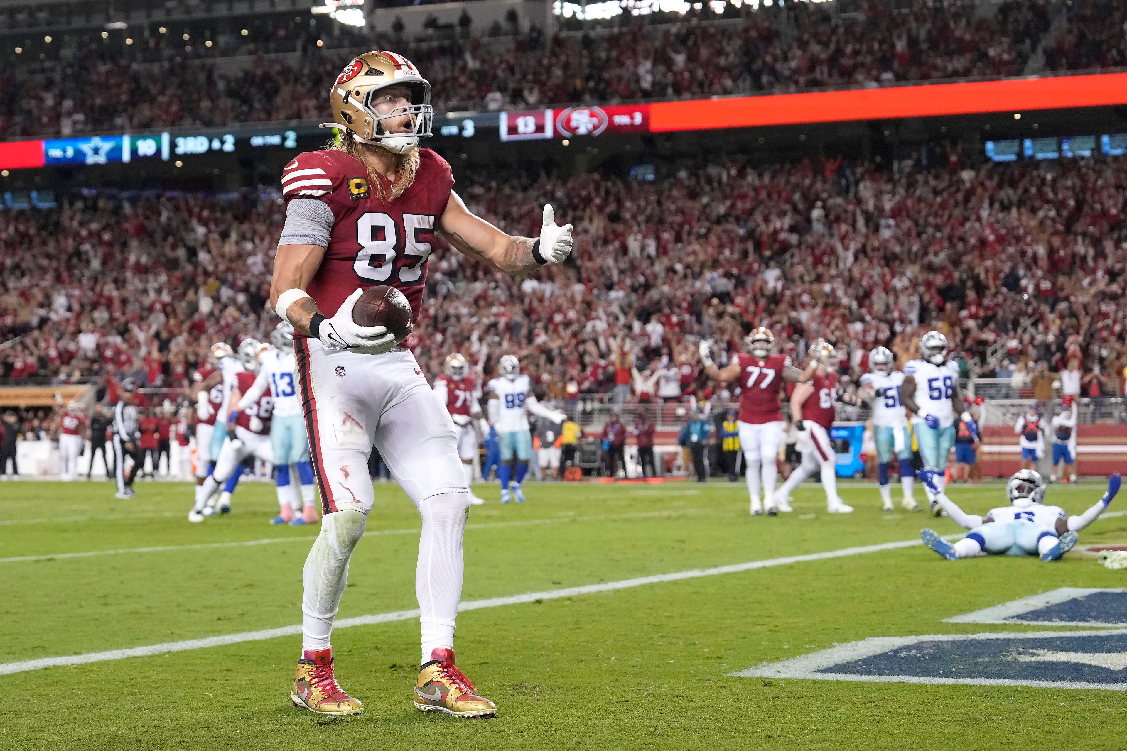 San Francisco 49ers tight end George Kittle (85) reacts after catching a touchdown pass against the Dallas Cowboys during the second half of an NFL football game in Santa Clara, Calif., Sunday, Oct. 27, 2024. (AP Photo/Tony Avelar)