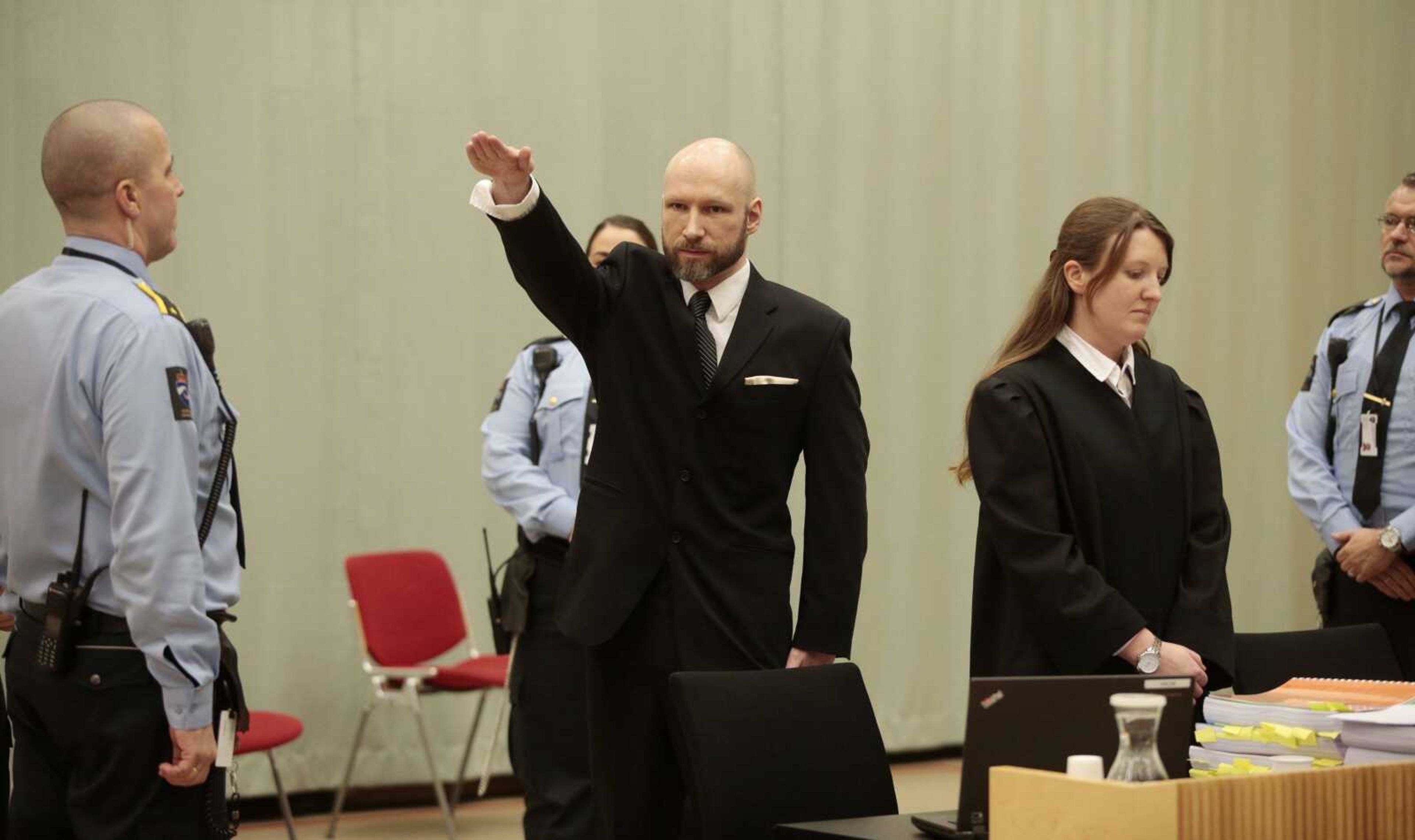 Anders Behring Breivik raises his right hand in a Nazi salute at the start of his appeal case Tuesday in Borgarting Court of Appeal at Telemark prison in Skien, Norway.