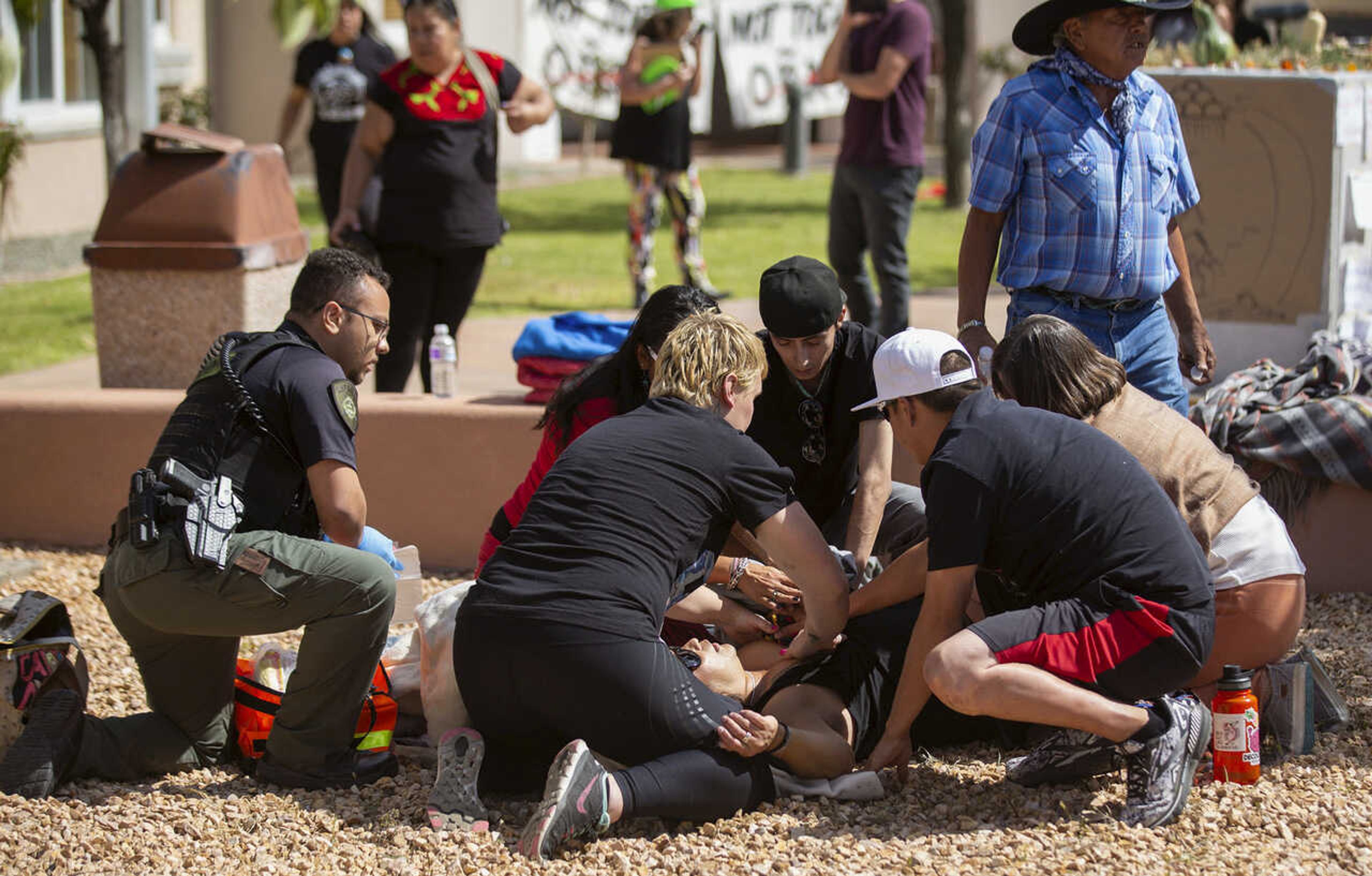 FILE - Activists tend to a shooting victim during a protest where officials had planned to install a statue of Spanish conquistador Juan de OÃ±ate Thursday, Sept. 28, 2023, in EspaÃ±ola, N.M. An appeals court on Monday, Nov. 20, has upheld a judge's decision to deny bail to Ryan David Martinez, of New Mexico man, who is charged with attempted murder in the September shooting of a Native American activist during confrontations about canceled plans to reinstall a statue of a Spanish conquistador. Martinez has pleaded not guilty to the charges in the shooting at the protest. (Luis Sanchez Saturno/Santa Fe New Mexican via AP)