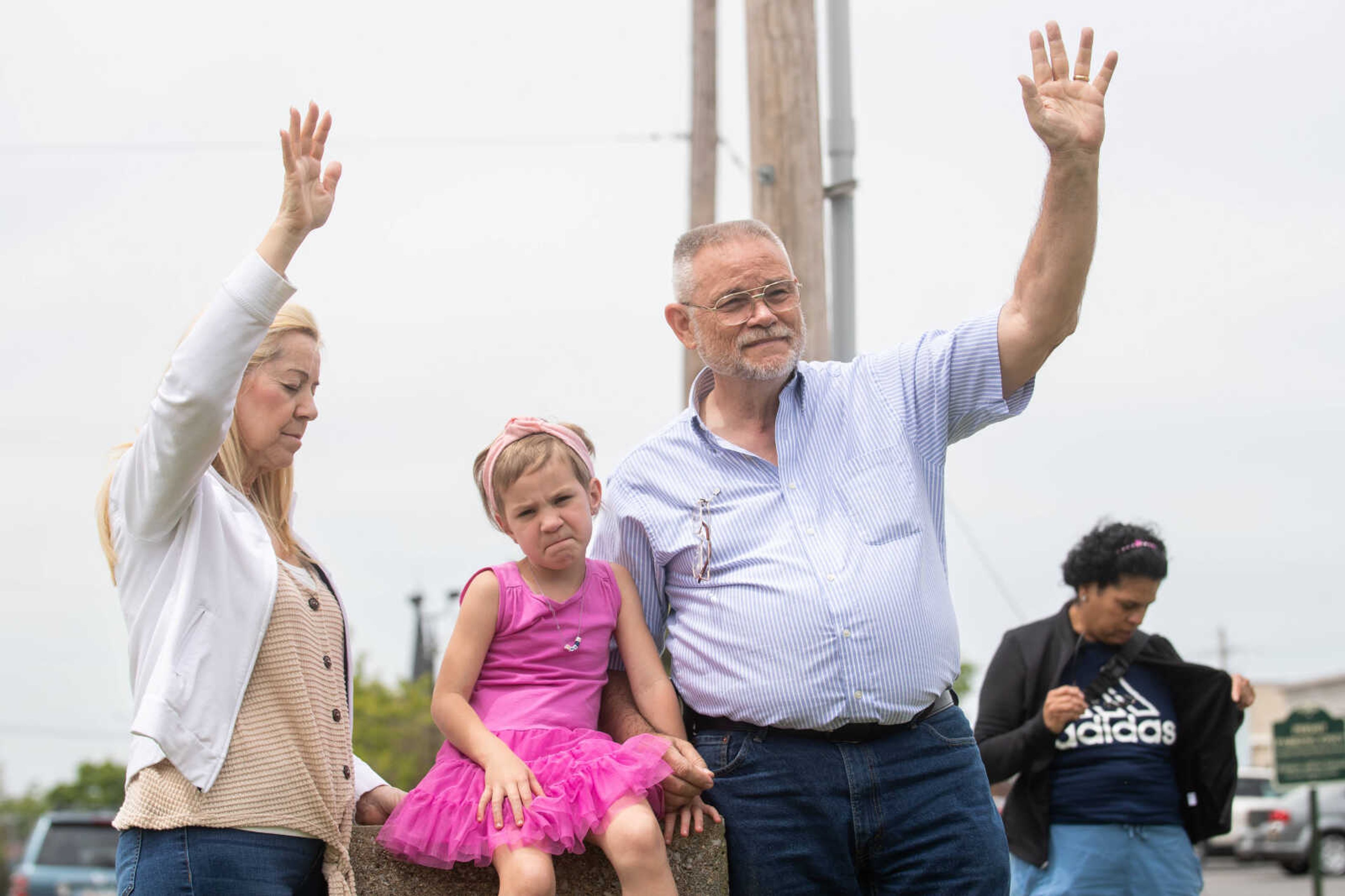 Norma and Dave Clark raise their arms in worship as they attend the National Day of Prayer ceremony with their granddaughter, Madelyn Clark, 4, on&nbsp;Thursday, May 4 at Cape Girardeau City Hall.