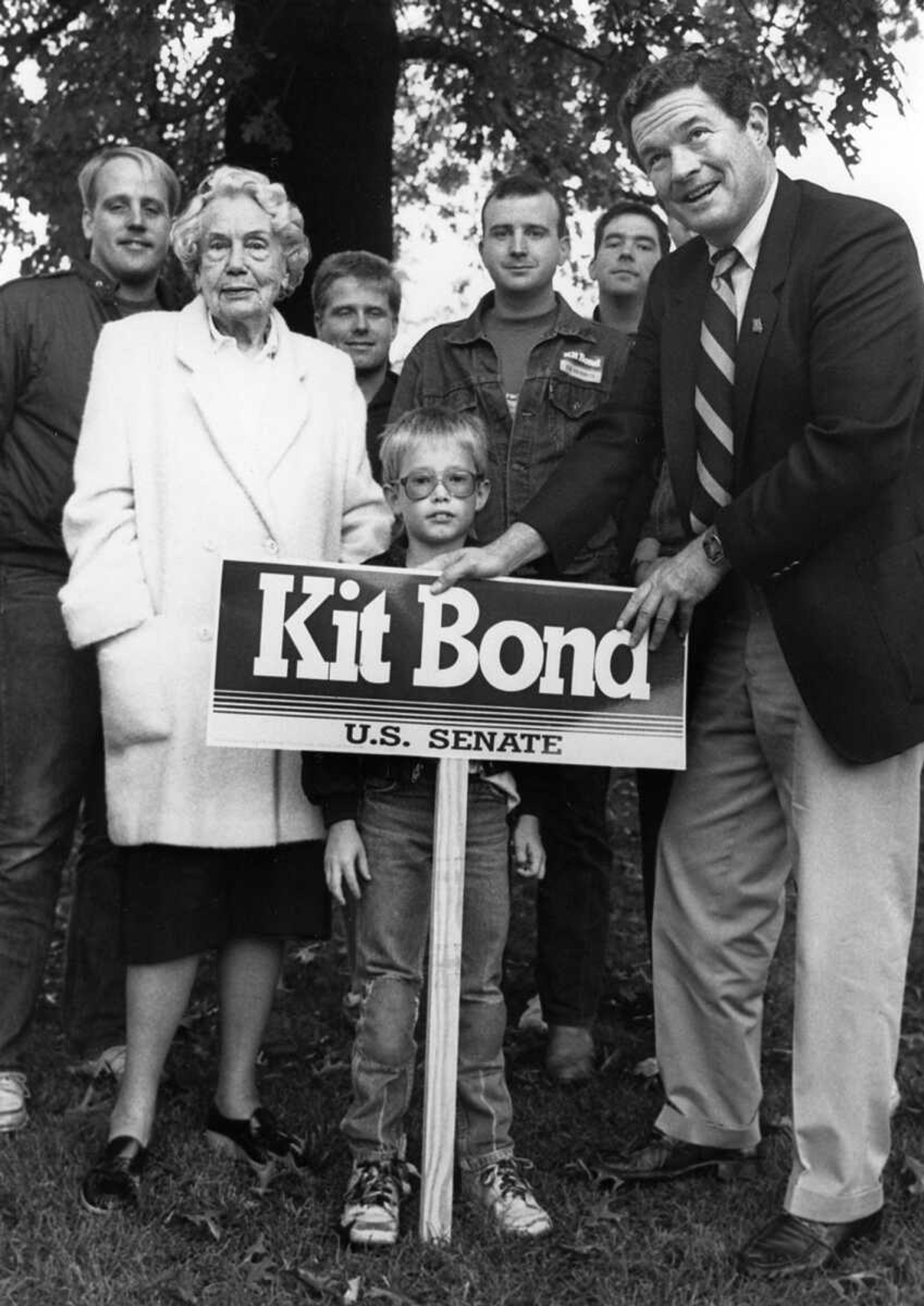 Southeast Missourian archive
Former Gov. Christopher Bond, right, stands with Alice Hulett of Cape Girardeau as he posts a campaign sign in her yard. A number of campaign volunteers look on. Bond, in a campaign swing to Cape Girardeau Saturday, said he was pleased with his performance in the Friday night debate with opponent Harriett Woods. (Oct. 26, 1986)