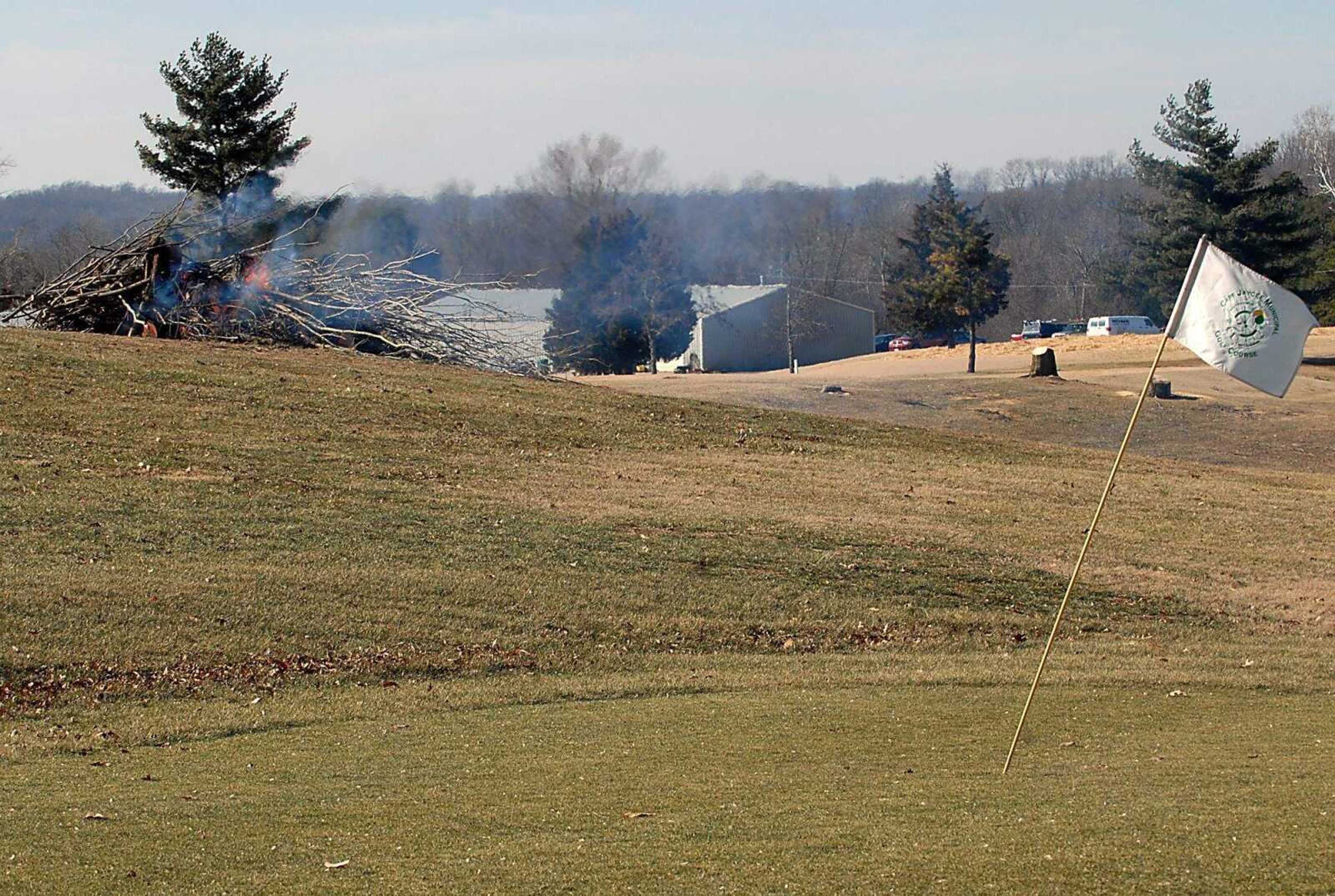 KIT DOYLE ~ kdoyle@semissourian.com
Trees that once bordered the fourth fairway burn Wednesday morning, January 21, 2009, at the Cape Girardeau Jaycee Municipal Golf Course.