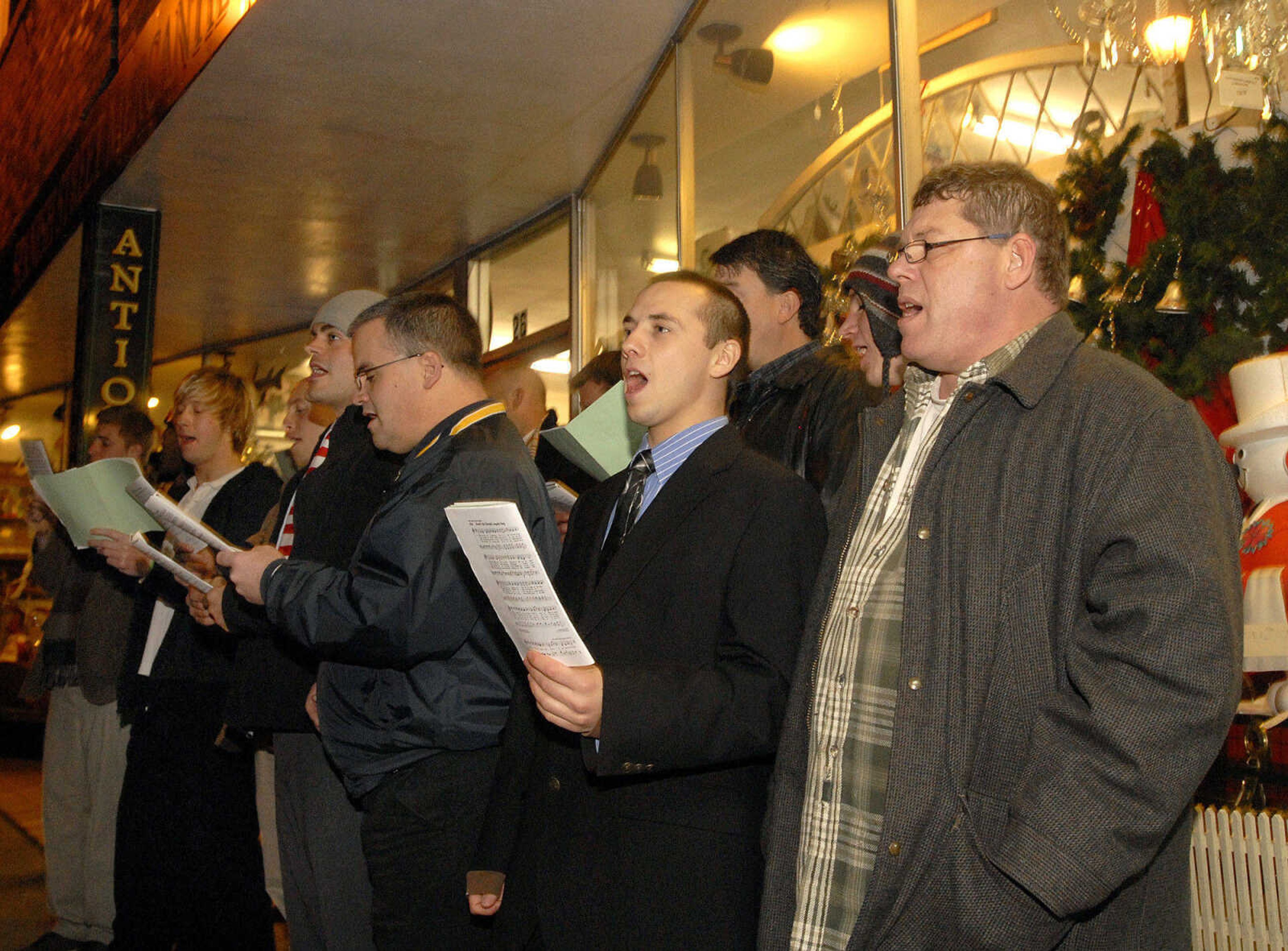 LAURA SIMON ~ lsimon@semissourian.com
Mid-America Teen Challenge New Creations Choir spread holiday cheer on Main Street by singing Christmas carols for all to hear Friday, Dec. 2, 2011 during Old Town Cape's annual Downtown Christmas Open House.