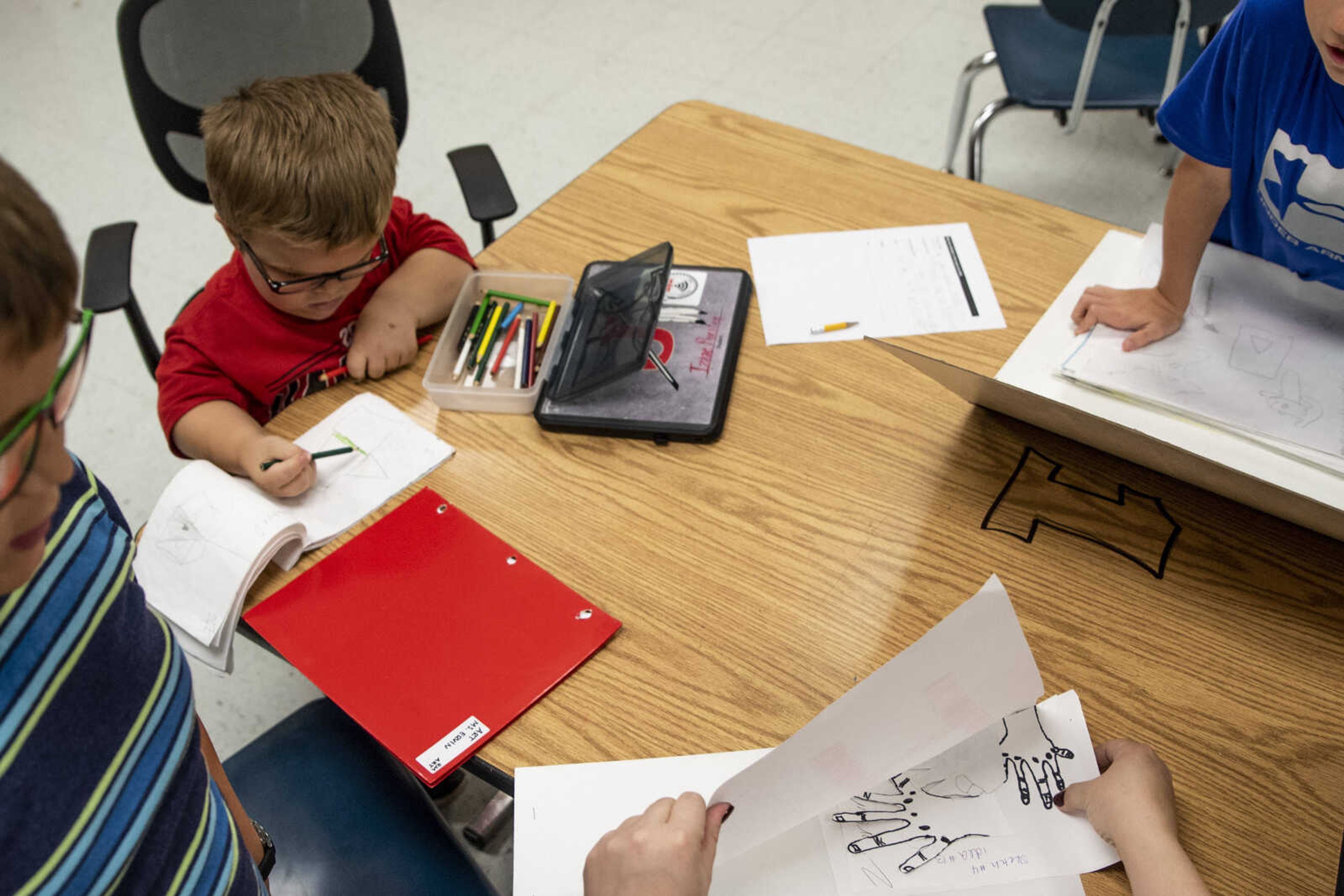 Izaac Pursley, top left, works on his art project during art class at Jackson Middle School Oct. 4, 2018, in Jackson.