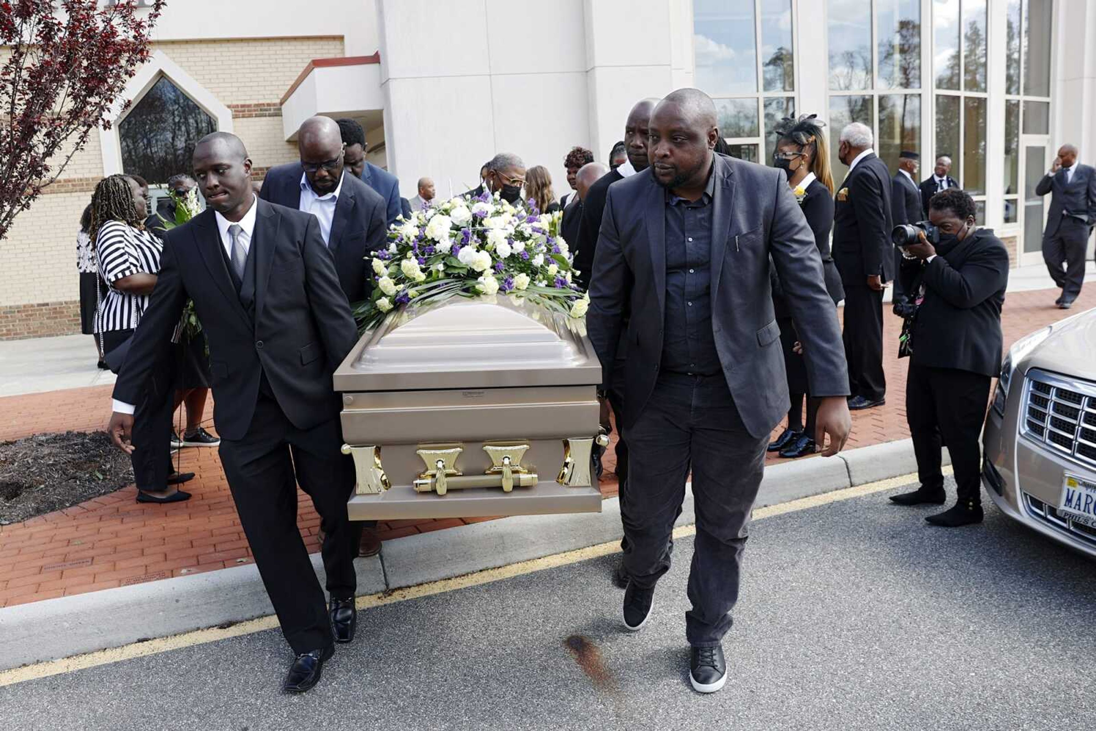 The casket of Irvo Otieno is carried out of First Baptist Church of South Richmond after the celebration of life for Irvo Otieno in North Chesterfield, Va., on Wednesday, March 29, 2023.  Irvo Otieno, a 28-year-old Black man, died after he was pinned to the floor by seven sheriff's deputies and several others while he was being admitted to a mental hospital. (Eva Russo/Richmond Times-Dispatch via AP)