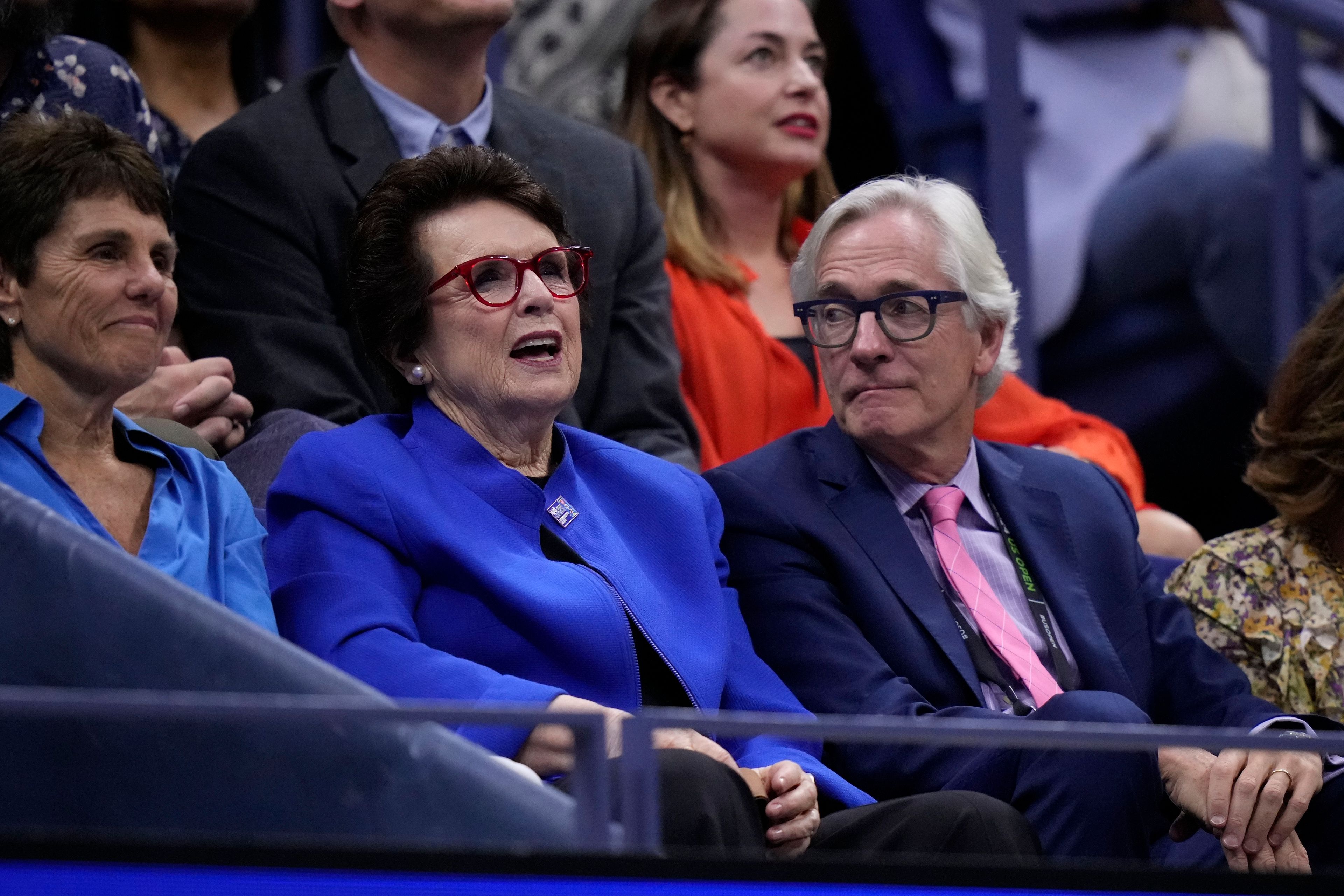 Billie Jean King, center, her wife Ilana Kloss and USTA president Brian Hainline watch the women's singles final of the U.S. Open tennis championships between Aryna Sabalenka, of Belarus, and Jessica Pegula, of the United States, Saturday, Sept. 7, 2024, in New York. (AP Photo/Frank Franklin II)