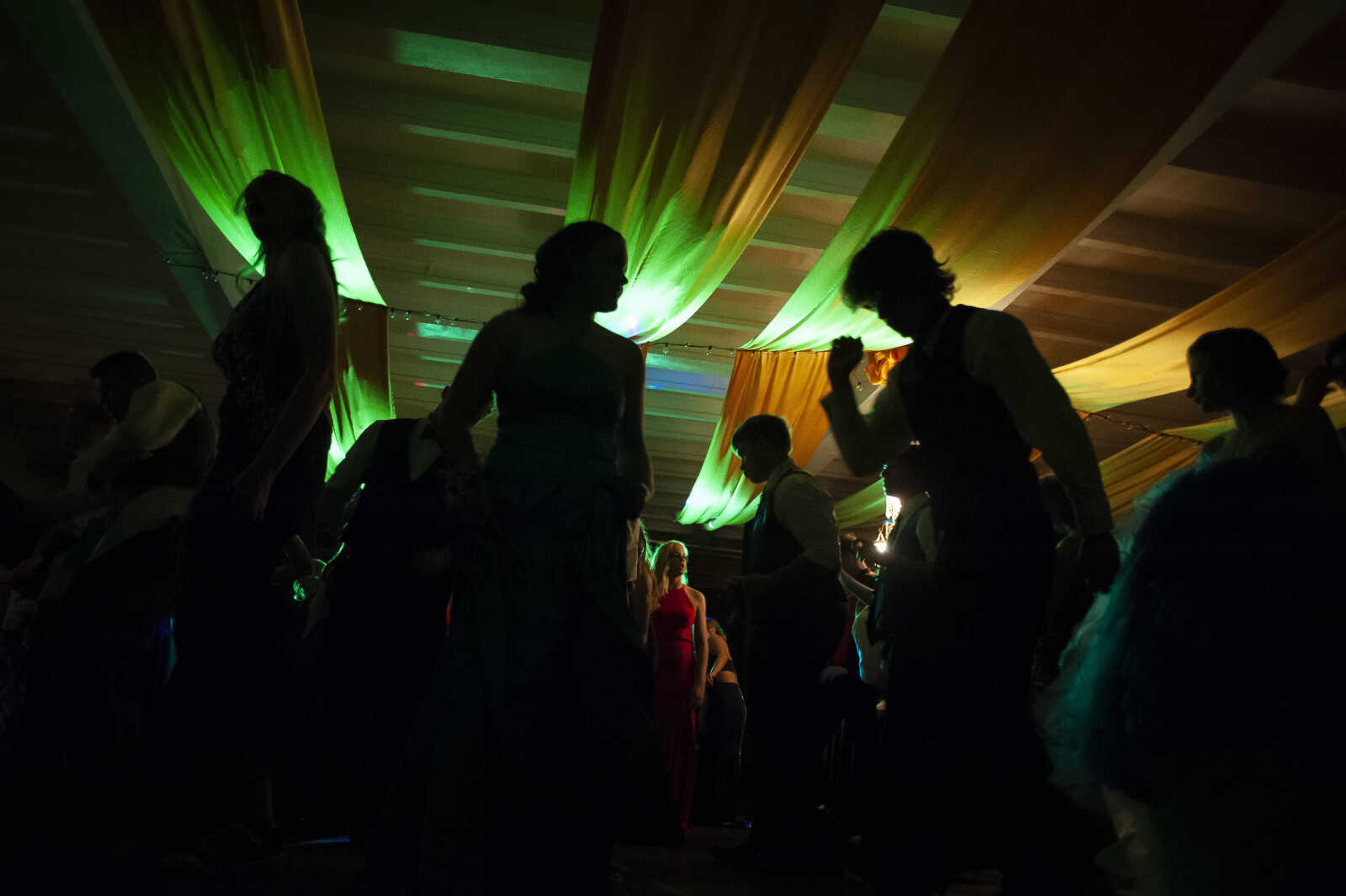 Prom guests dance during Leopold High School's "Masquerade at Midnight" prom Saturday, April 27, 2019, in Leopold.