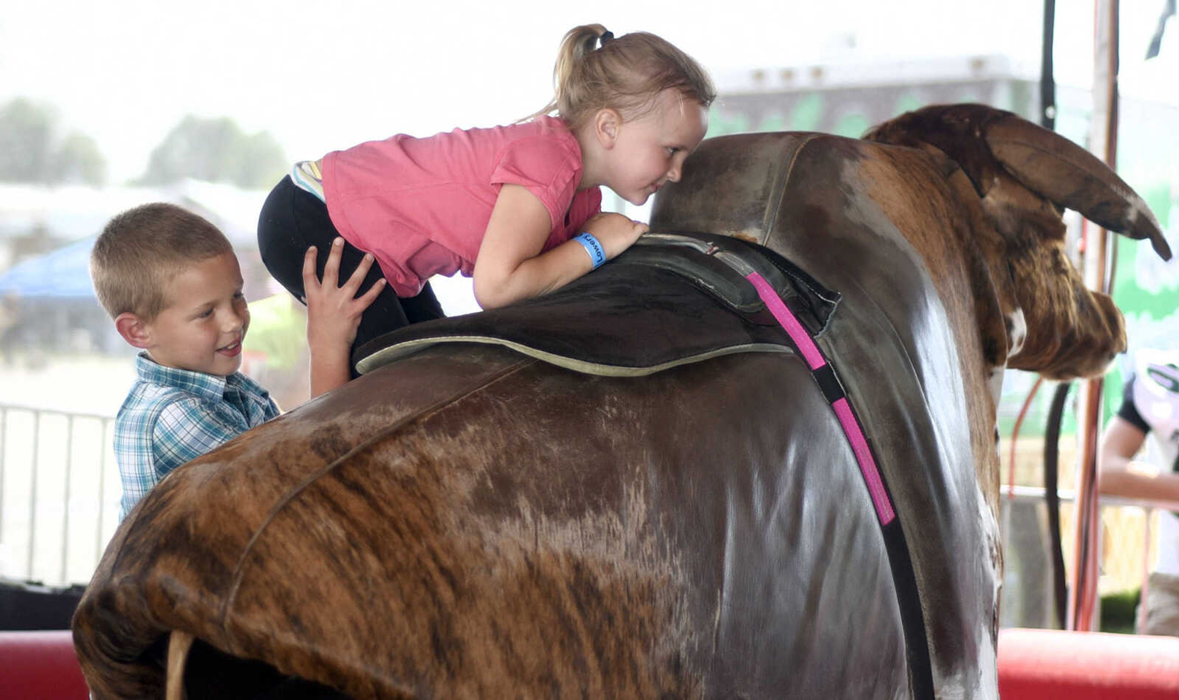 LAURA SIMON ~ lsimon@semissourian.com

People take a shot at the mechanical bull in the 8 Seconds Productions booth at the SEMO District Fair on Friday, Sept. 16, 2016, at Arena Park in Cape Girardeau.