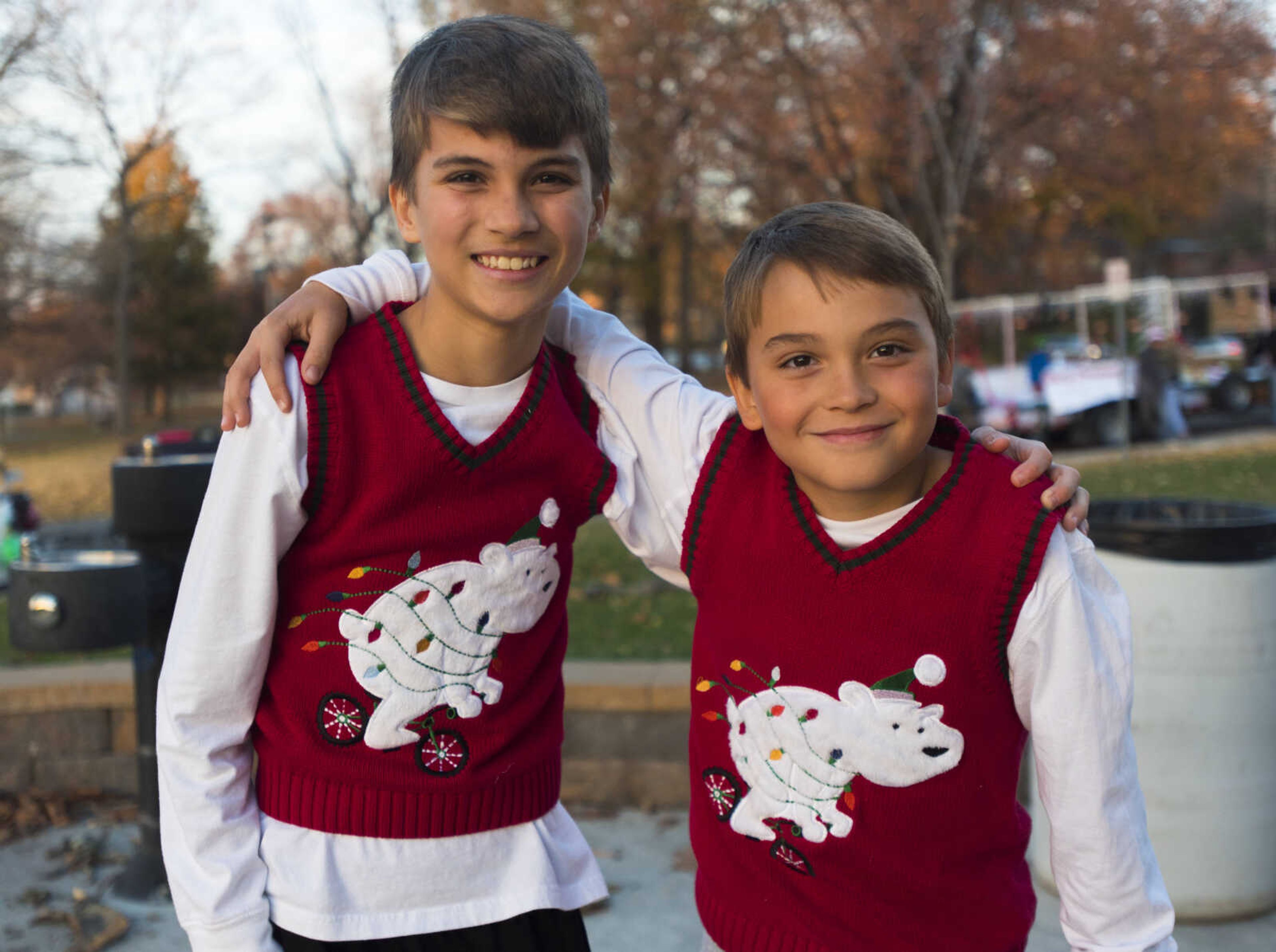 Wilson Clay, 13, left, and Cole Clay, 9, sport matching Christmas sweater vests Nov. 26, 2017, at the 26th annual Parade of Lights in Cape Girardeau.