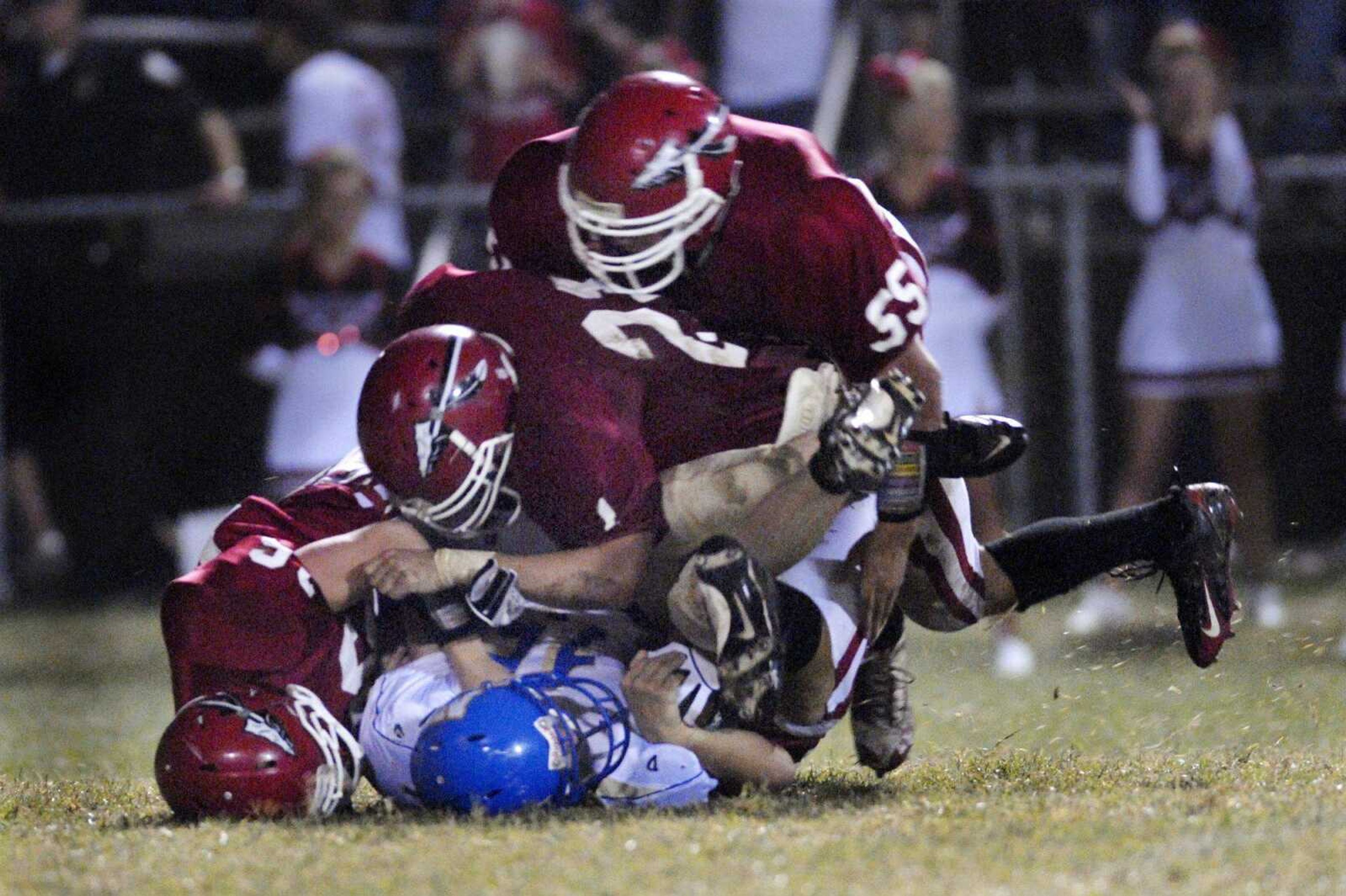 Jackson's Stetson Proffer, Austin Gonzaque, and Michael Riney, from bottom, pile on North County's John Stabenow during the third quarter of a game on Friday, Sept. 10, 2010, in Jackson. Jackson defeated North County 17-0. (Kristin Eberts)