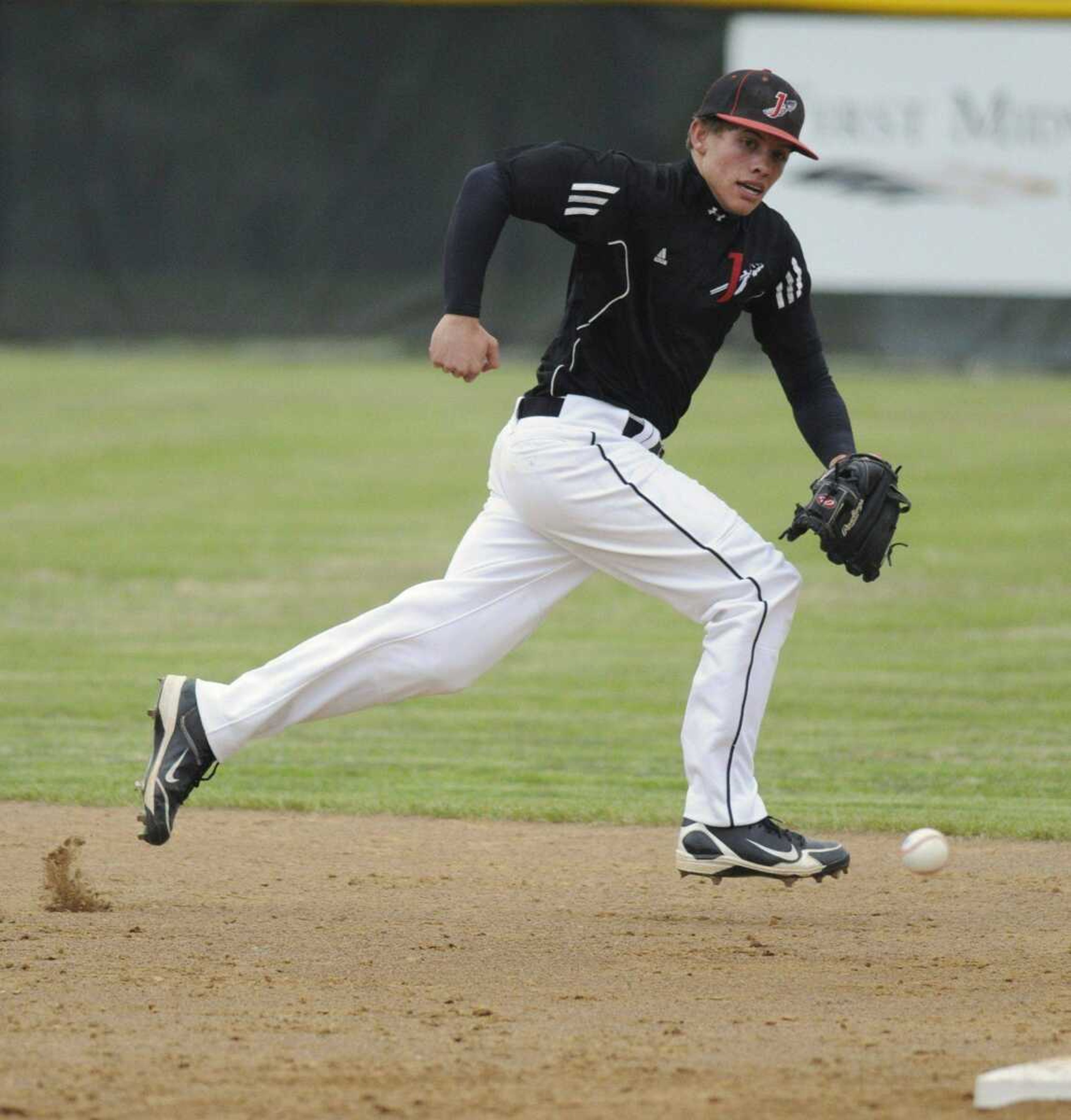 Jackson shortstop Dylan Koehler chases after a single during the first inning Thursday in Poplar Bluff, Mo. (BRIAN ROSENER ~ Daily American Republic)