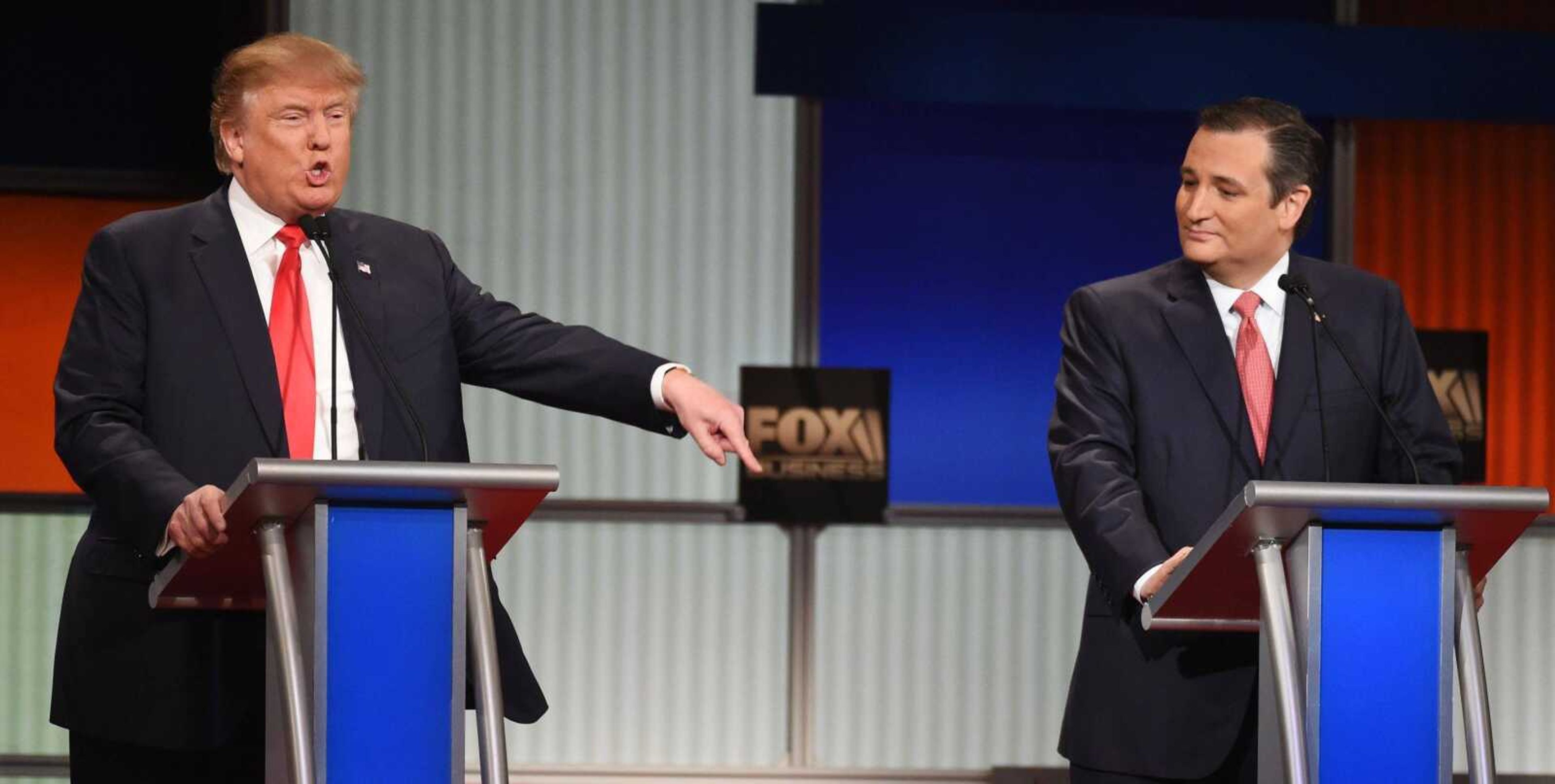 Republican presidential candidate, businessman Donald Trump speaks as Republican presidential candidate, Sen. Ted Cruz, R-Texas, looks on during the Fox Business Network Republican presidential debate Thursday at the North Charleston Coliseum in North Charleston, South Carolina. (Rainier Ehrhardt ~ Associated Press)