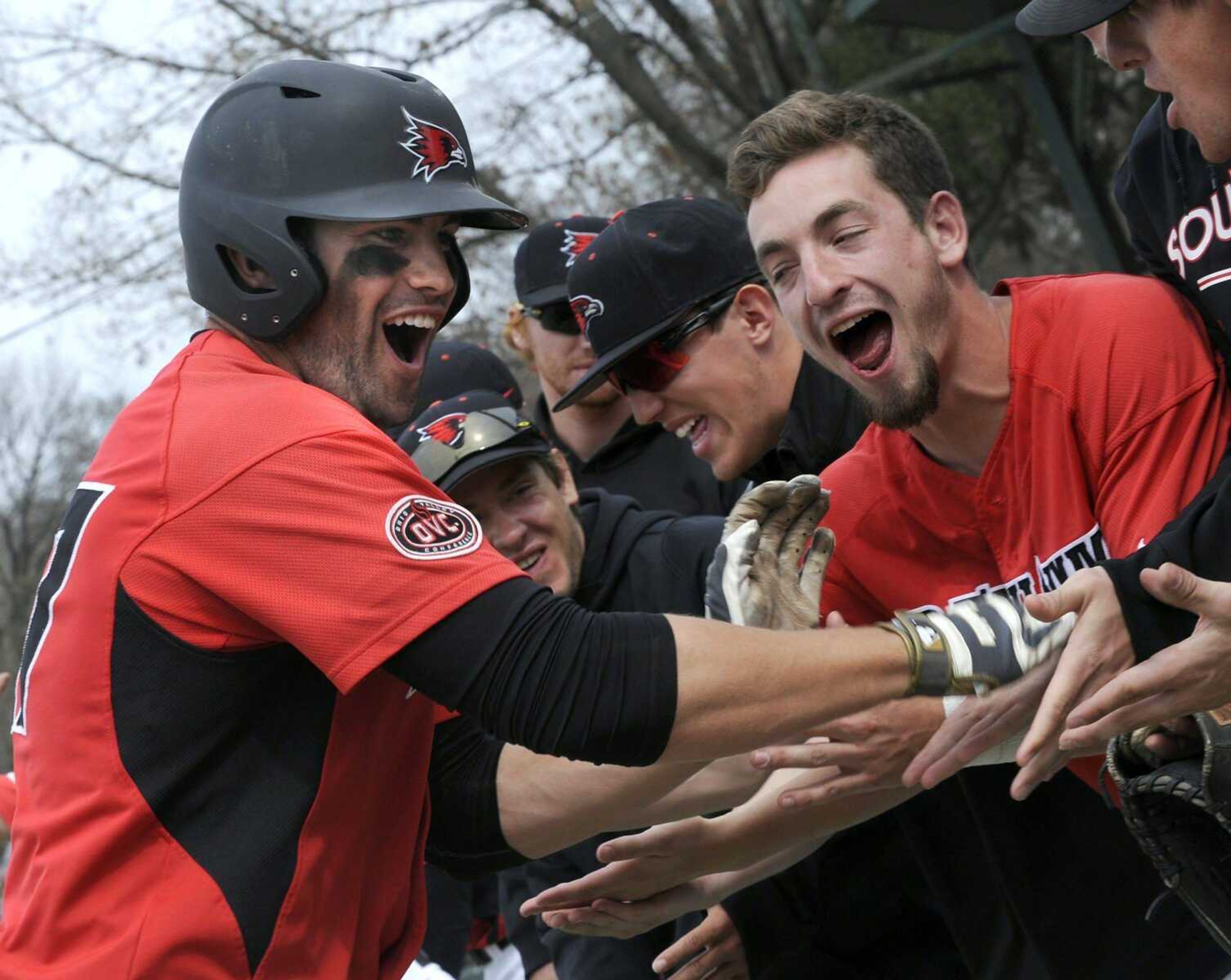 Southeast Missouri State&#8217;s Derek Gibson is congratulated by teammates on his way back to the dugout after hitting a grand slam against SIUE during the eighth inning Sunday at Capaha Field. Southeast won 12-1. (Fred Lynch)