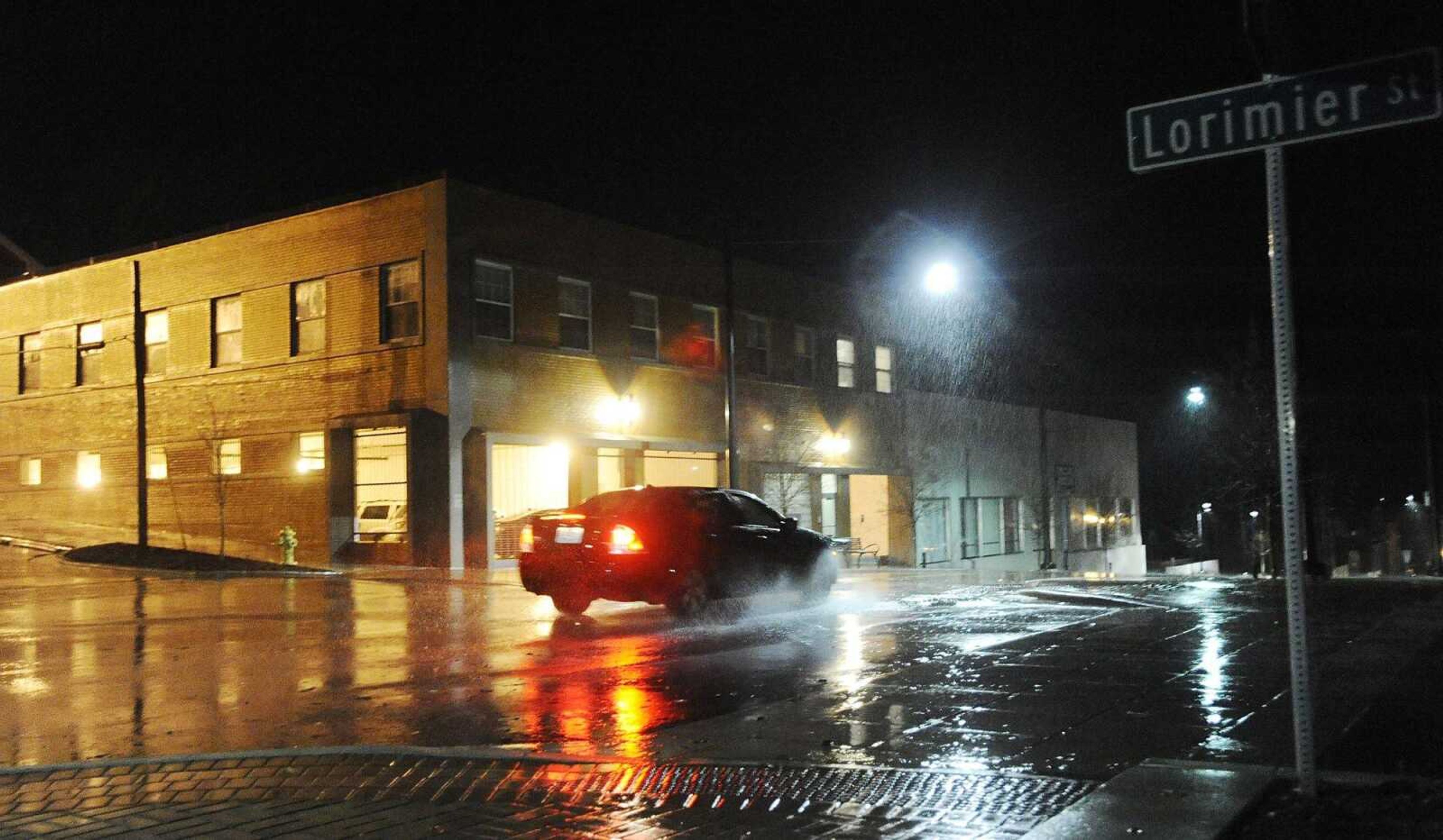 A car drives through the intersection of Broadway and Lorimier Street
Tuesday night after a tornado watch turned briefly into a tornado warning in Cape Girardeau. (Adam Vogler)