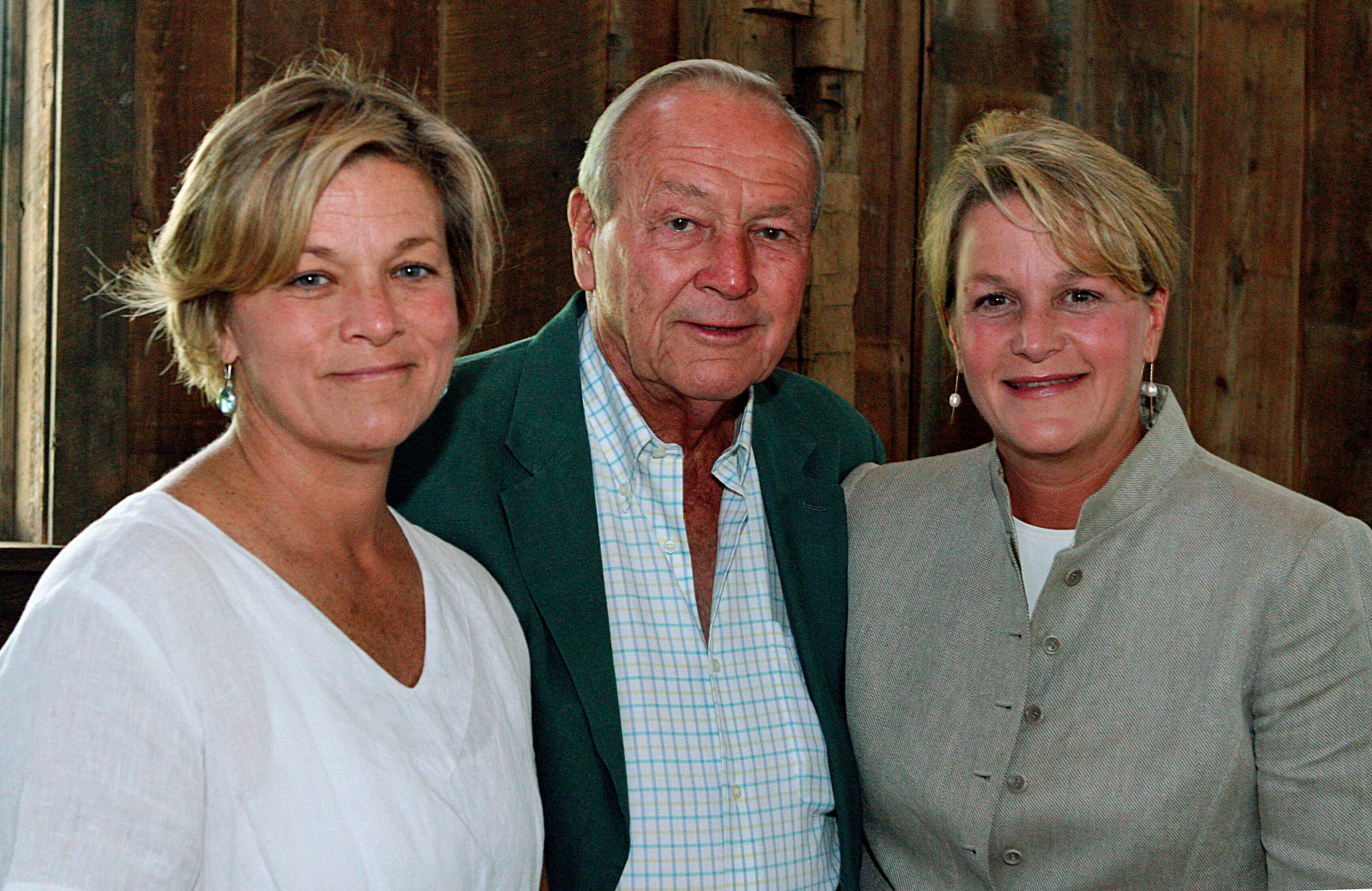 FILE - Arnold Palmer, center, is seen with his daughters, Peggy Palmer, left, of Durham, N.C., and Amy Saunders, of Orlando, Fla., inside the barn of the Winnie Palmer Nature Reserve, in Latrobe, Pa., during the dedication of the reserve June, 30, 2007. ( Kim Stepinsky/Pittsburgh Tribune-Review via AP, File)