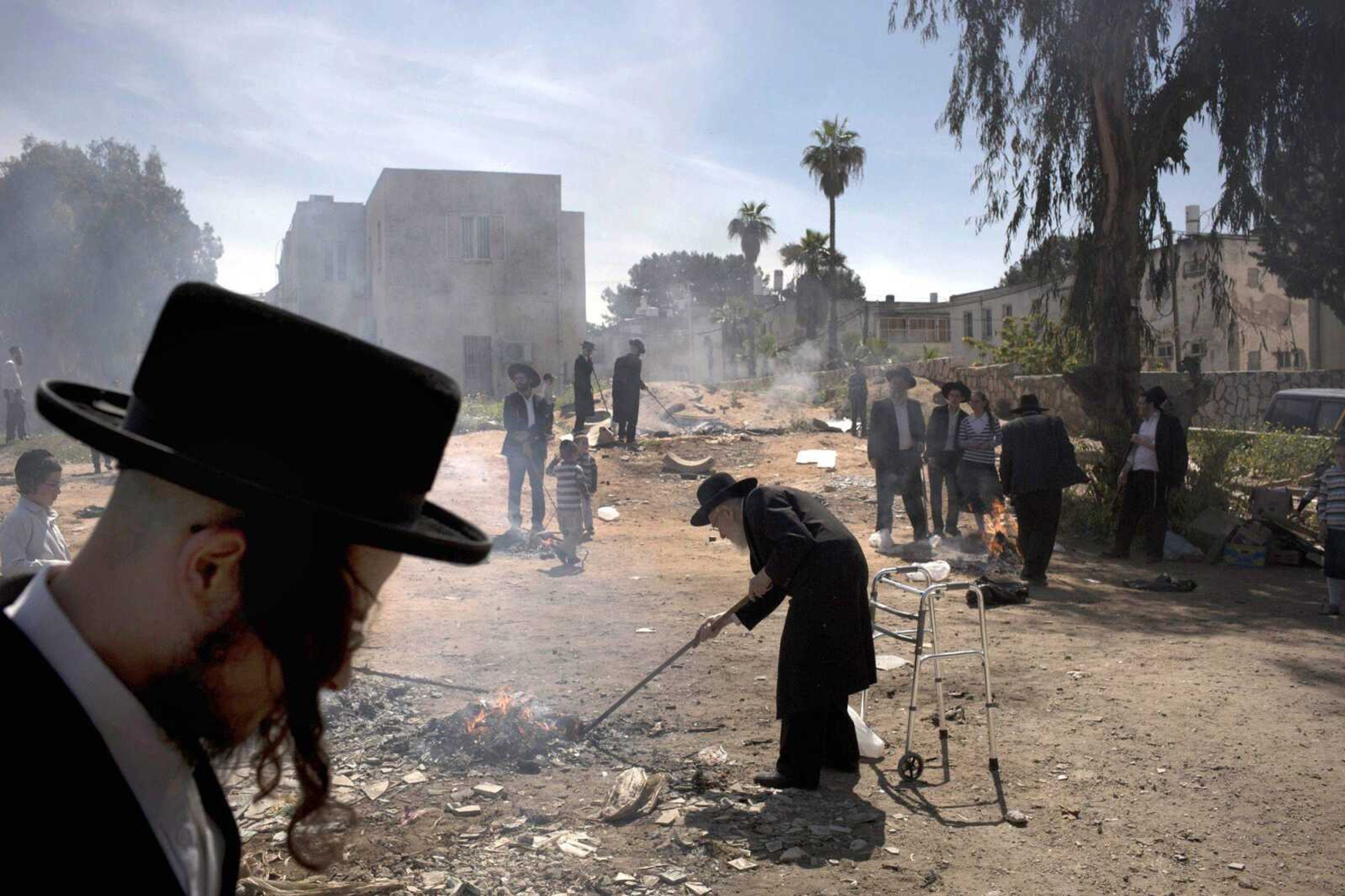 Ultra-Orthodox Jewish men burn leavened items in final preparation for the Passover holiday Monday in the ultra-Orthodox Jewish town of Bnei Brak, near Tel Aviv, Israel. Jews are forbidden to eat leavened foodstuffs during the Passover holiday that celebrates the biblical story of the Israelites&#8217; escape from slavery and exodus from Egypt. (Oded Balilty ~ Associated Press)