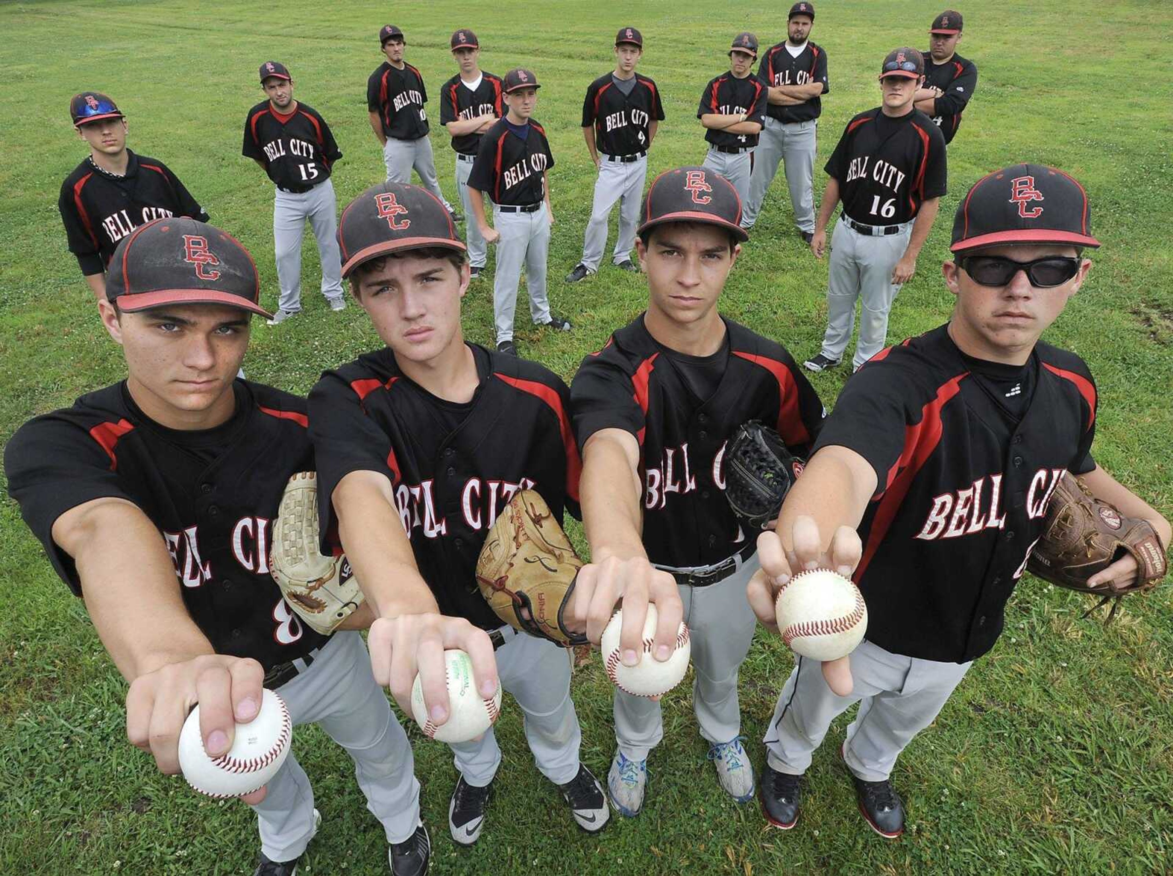 Bell City pitchers, from left, Peyton Maddox, Austin Hicks, Cole Nichols and Bobby Wright, show their preferred grips with their team Sunday, May 31, 2015 in Bell City, Missouri. (Fred Lynch)